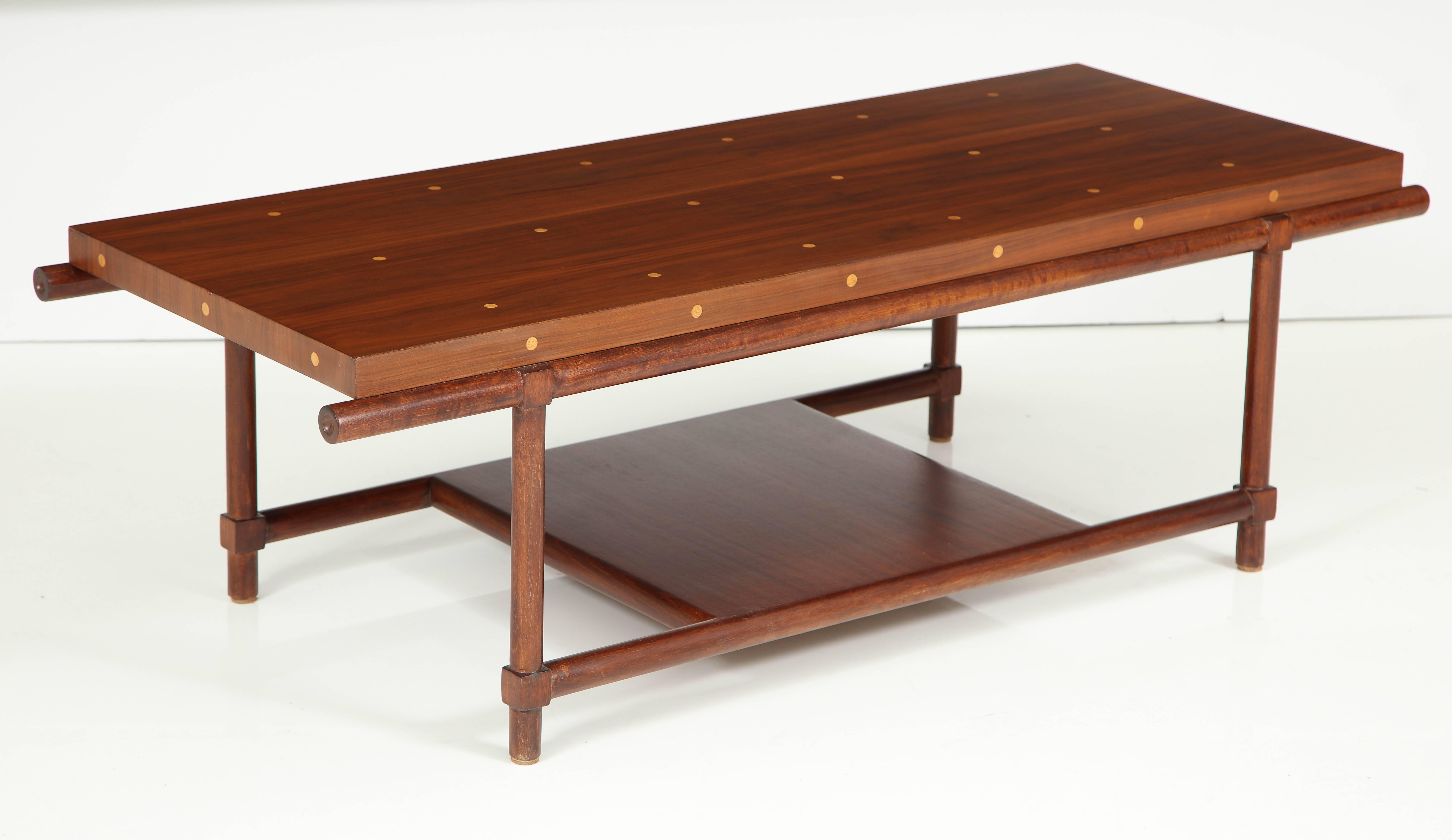 Mid-Century walnut coffee table with maple dot inlay details. Designed by Tommi Parzinger for Parzinger originals.