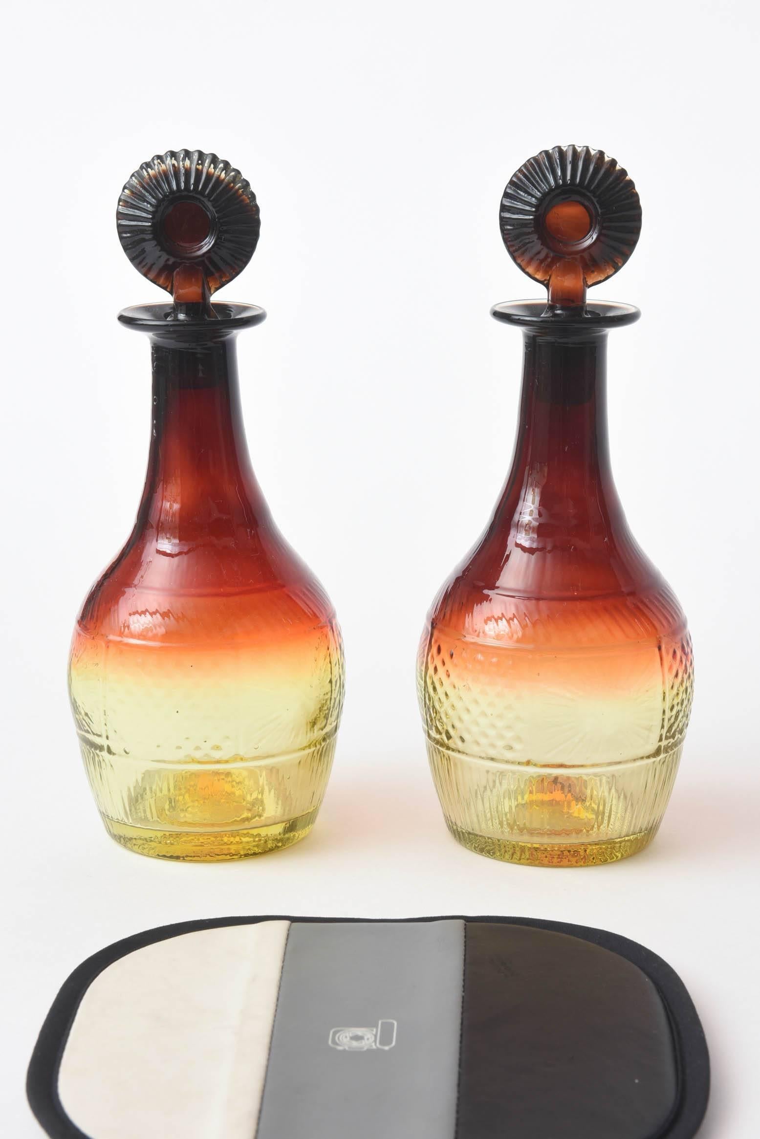 A great pair of antique decanters with unique stoppers and all over design. Decorative and practical and in fine antique condition.