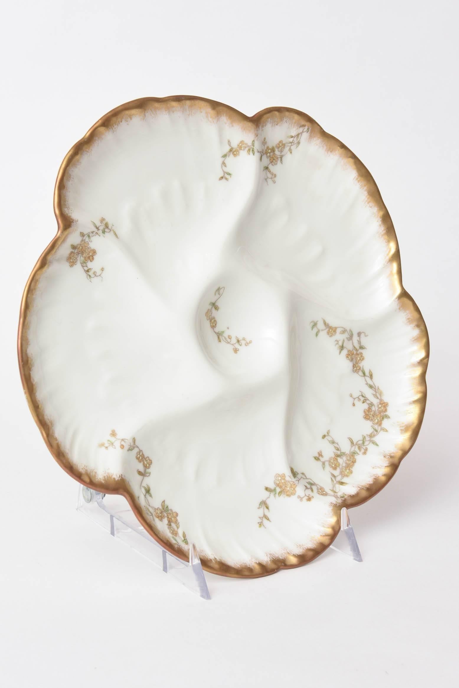 A Classic and elegant oyster plate for your collection. Gilded shaped edge with nice centre well and delicate hand-painted design. We have more of these, please inquire.