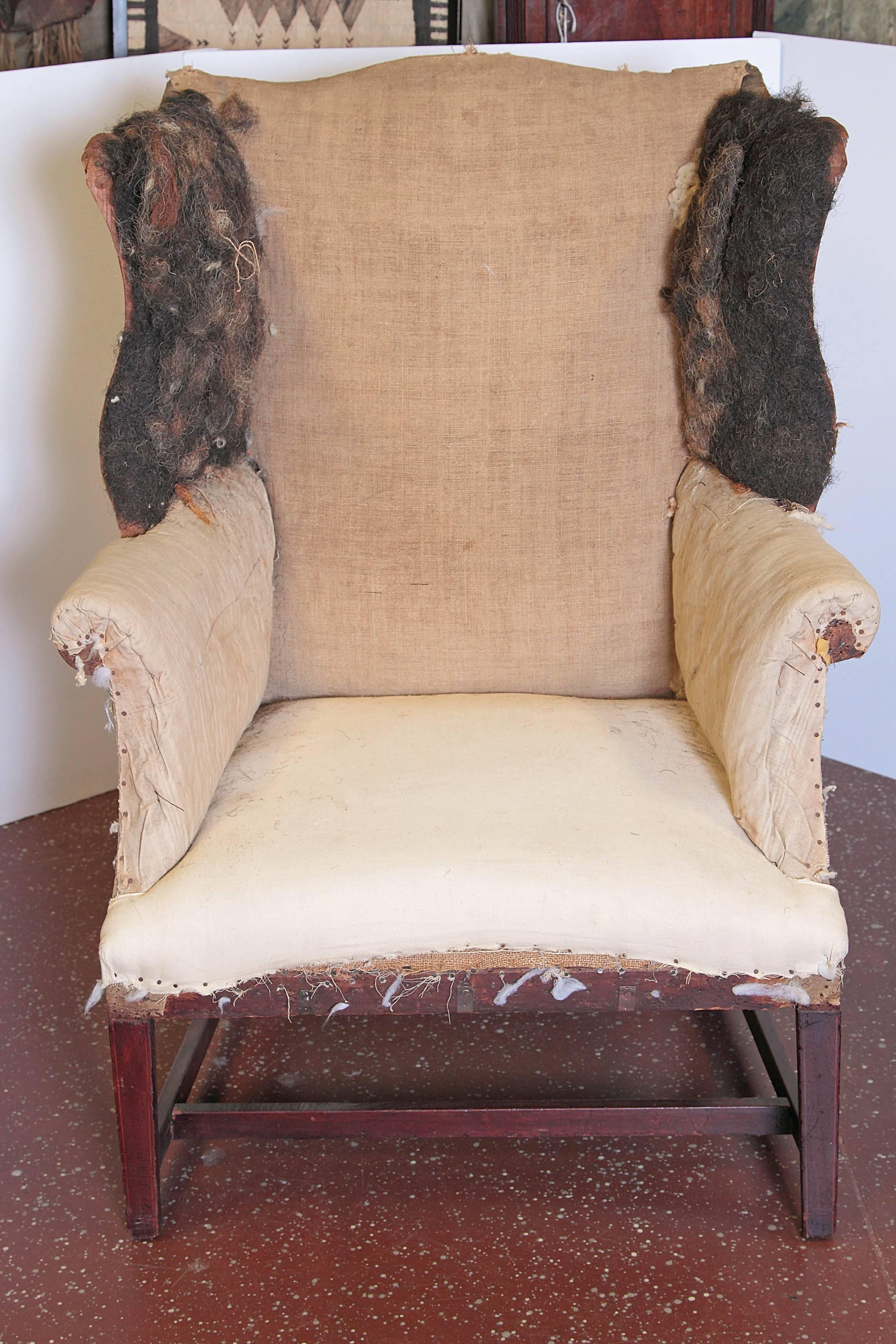 Period American Hepplewhite wing chair on square tapered legs with string inlay and 