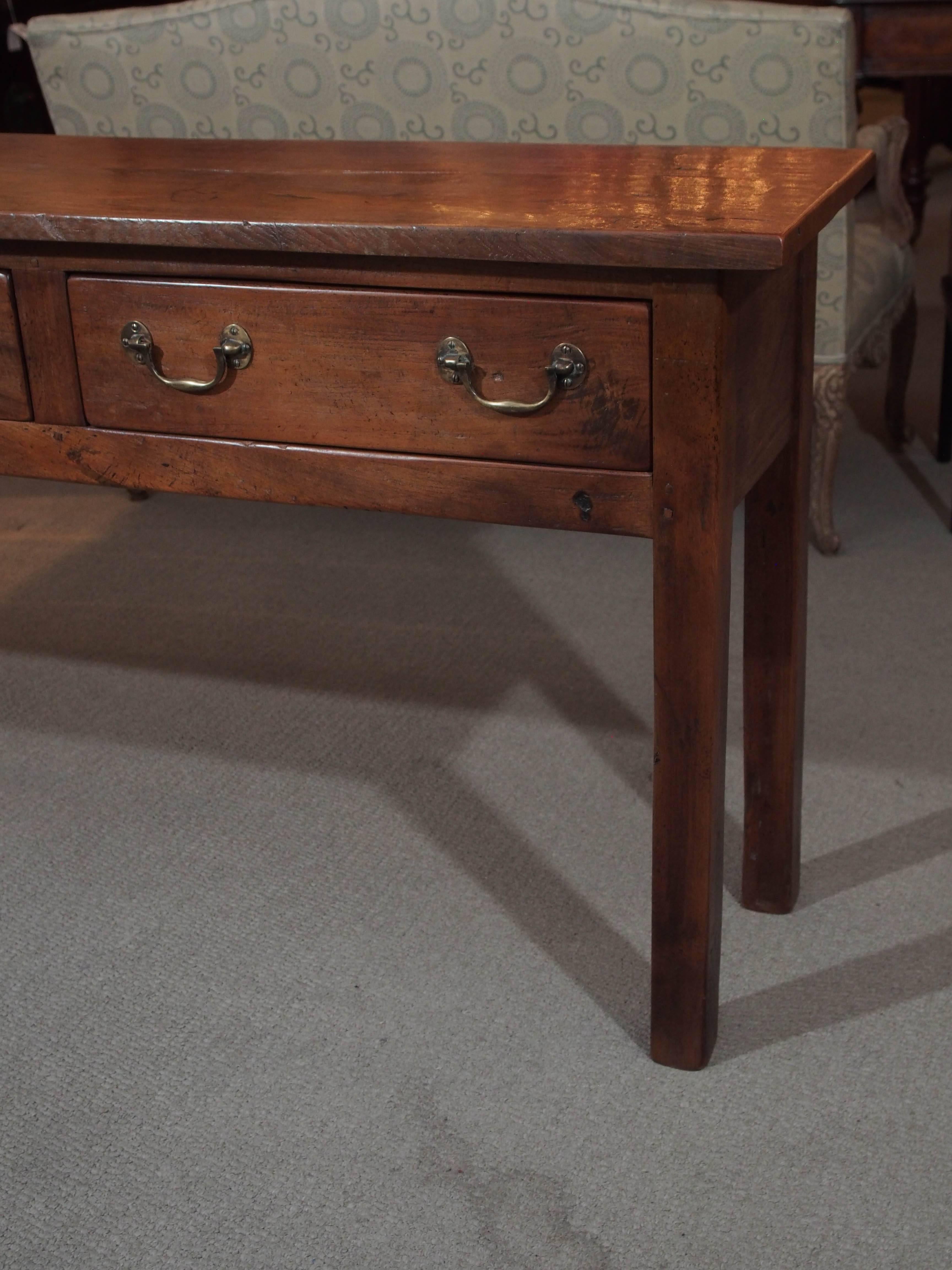 Antique French elm country three-drawer server.