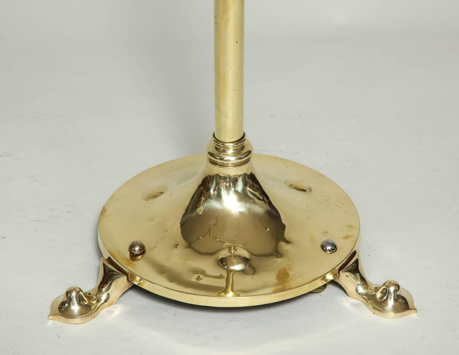 Fine English brass floor lamp in the manner of W.A.S. Benson having a ringed and telescopic shaft over round platform base with embossed bosses and mixed metal rivets, unsigned and now wired for electricity.

Measures: Height lowest 55