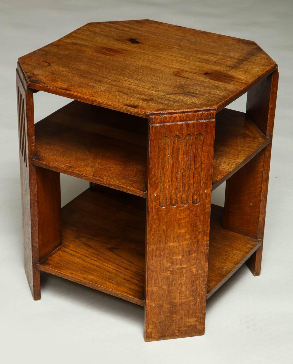 English octagonal side table (cocktail table), possibly by Heal and Co. The chamfered legs with reeded edges and having two useful under tier shelves, 1930s.