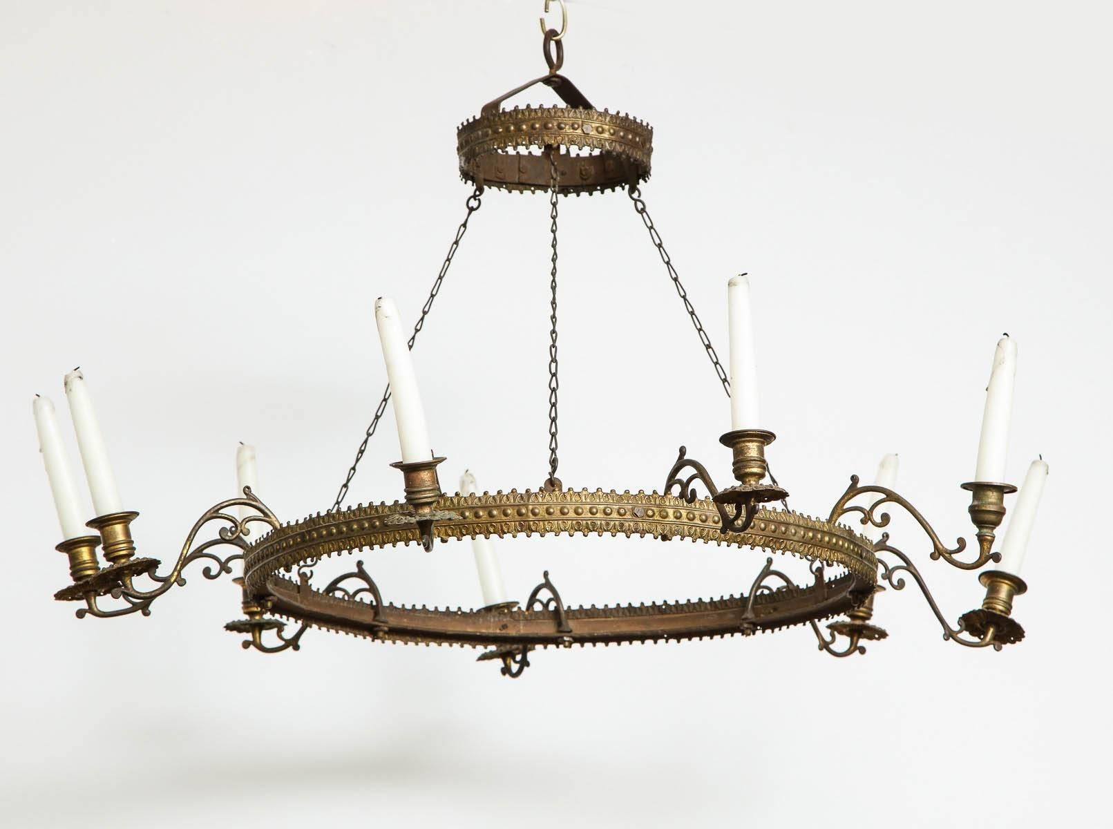 A nine candle light Swedish repousse brass and wrought iron ring chandelier with a simple, elegant design. Unusually shallow drop. Sweden, circa 1830.

   