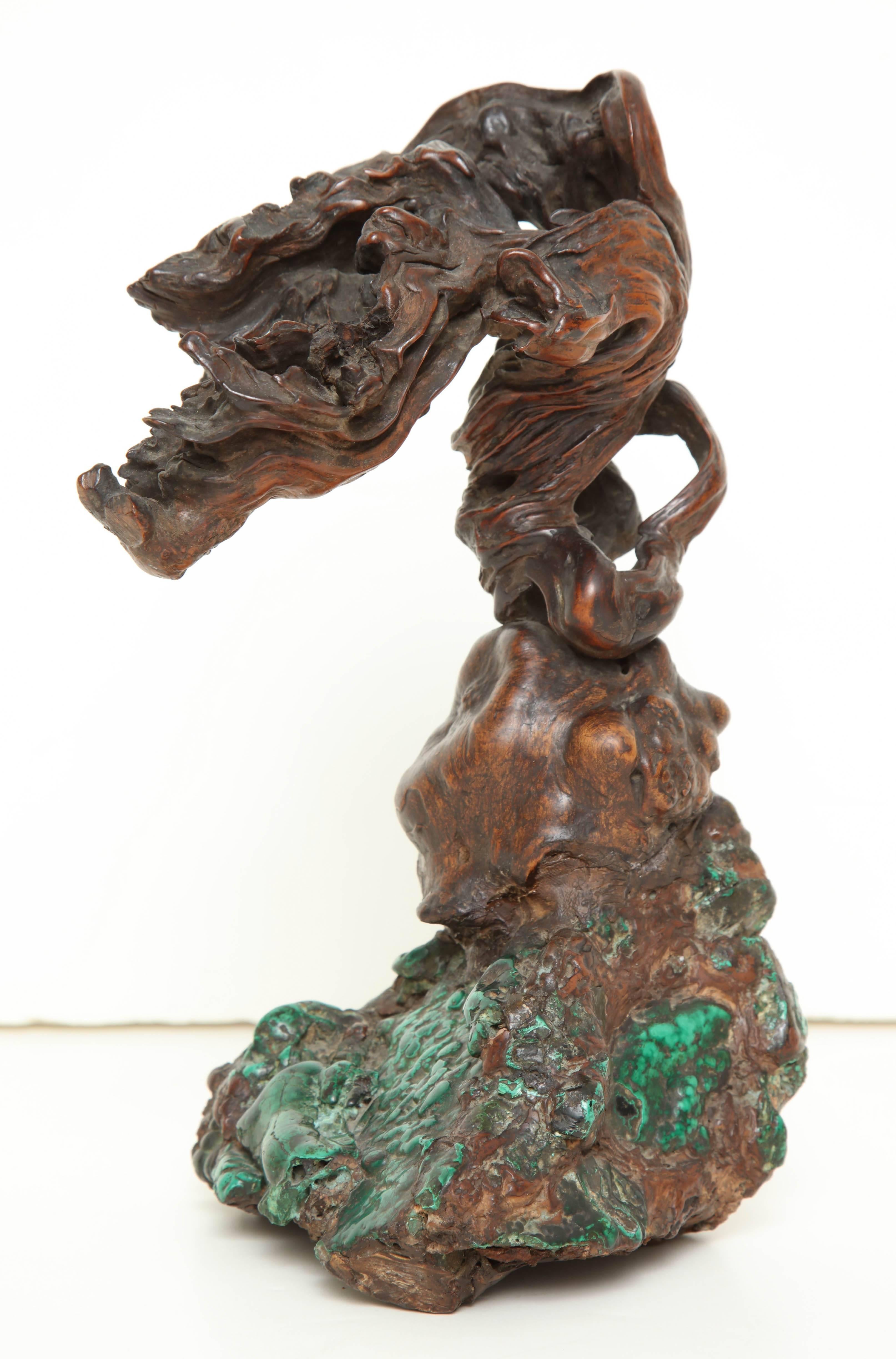 A 19th century Chinese scholar’s object,
rootwood growing from malachite.
 