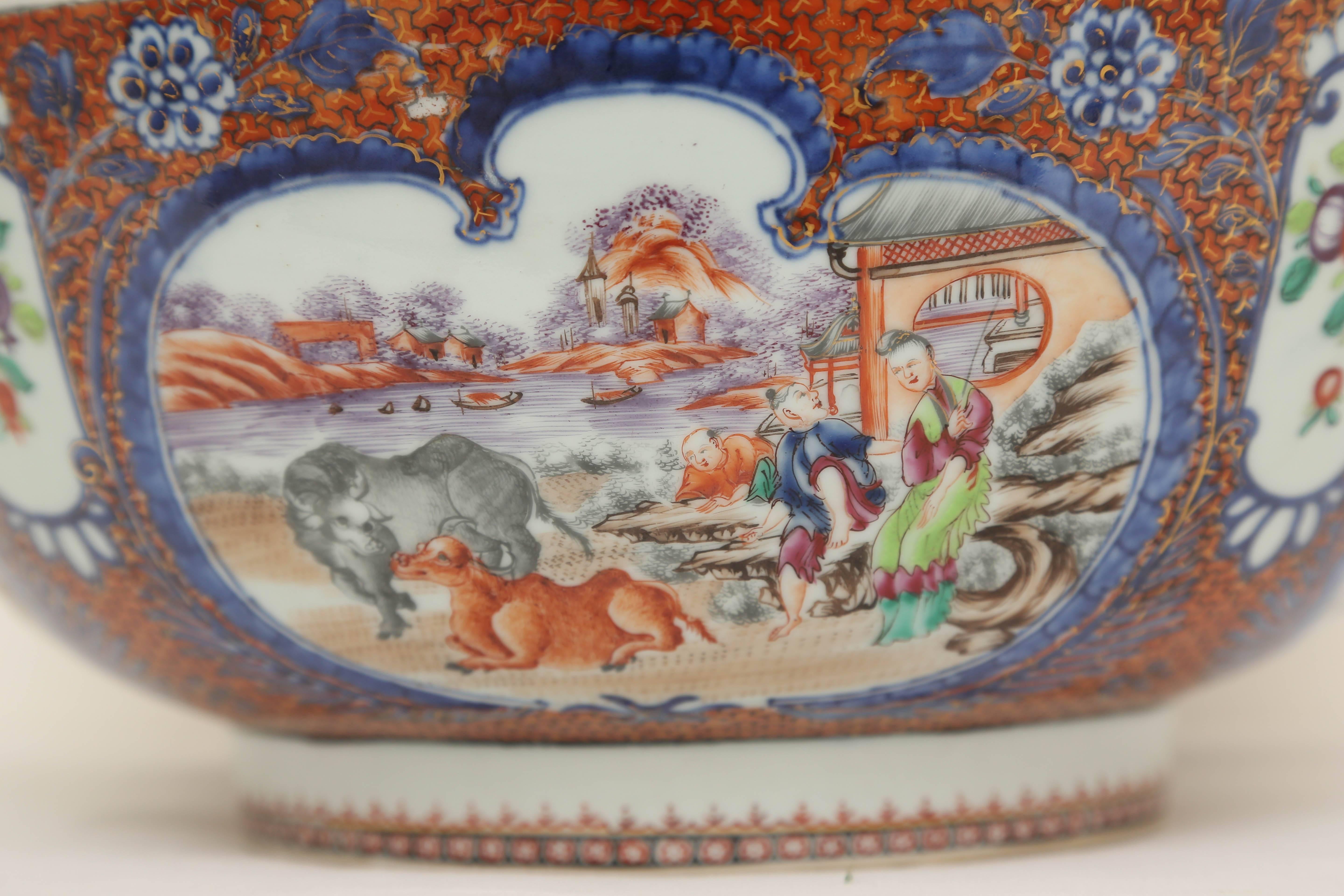 Featuring scenes of figures with oxen in a river landscape setting within lobed cartouches.