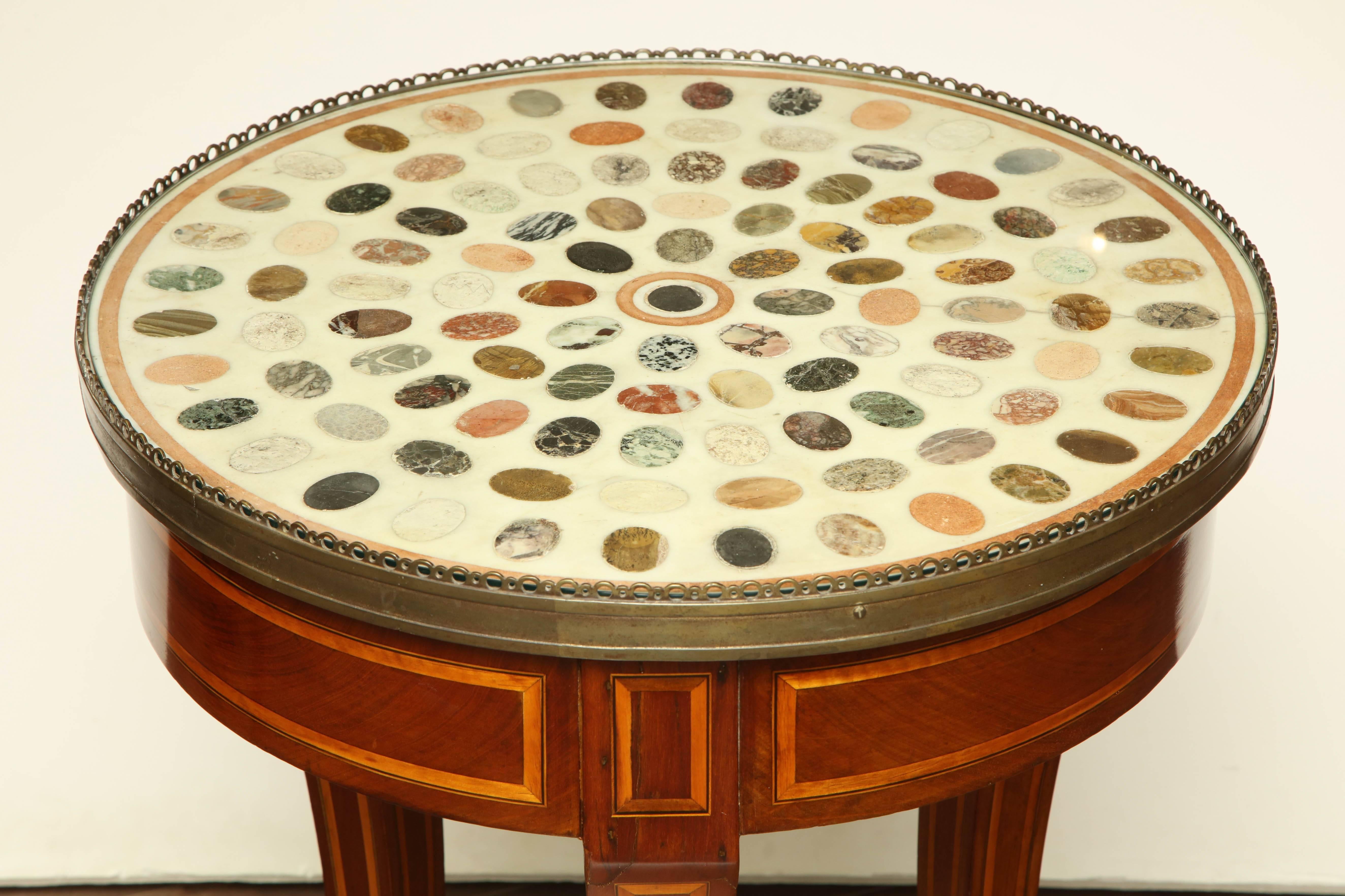 Unusual early 19th century English Regency specimen marble table with brass gallery.
