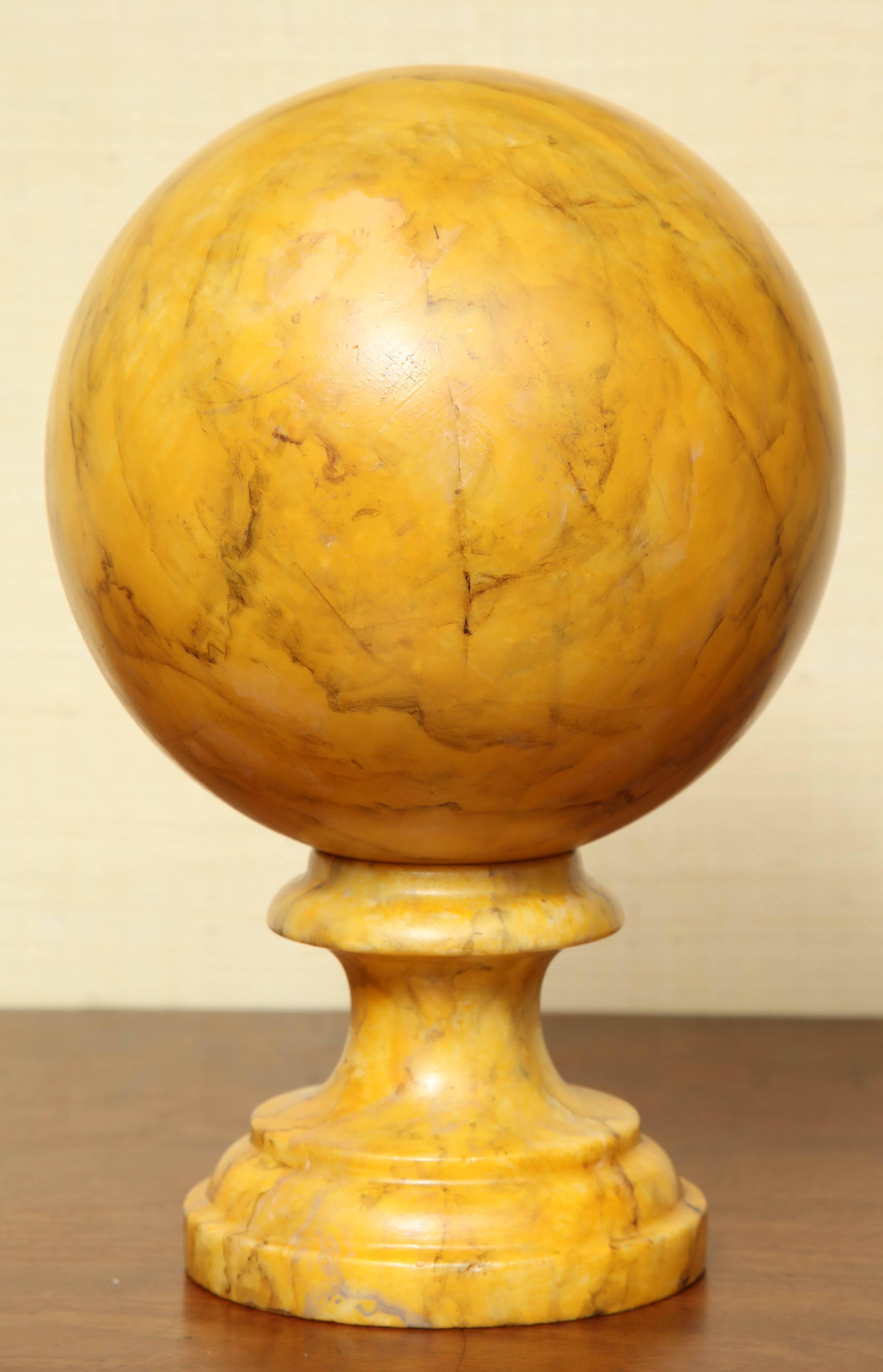 Faux marbre finished, marble ball on stand.