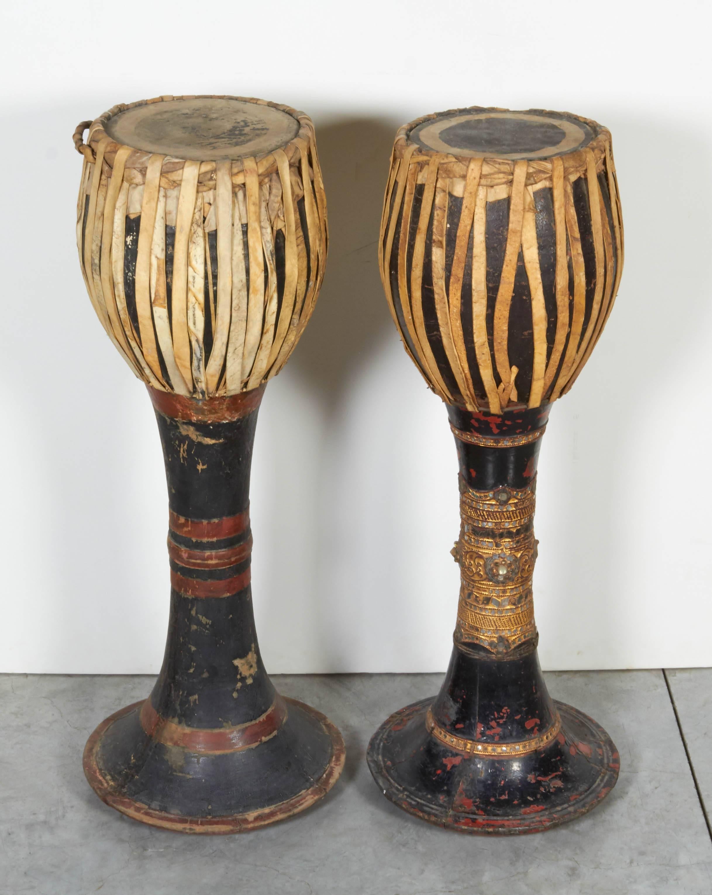 Two striking and well decorated hill tribe drums from northern Thailand. The attractive patina of these drums shows years of use in ceremonies by the hill tribes along the border between Burma and Thailand.

Only one piece available. 
RIGHT drum in