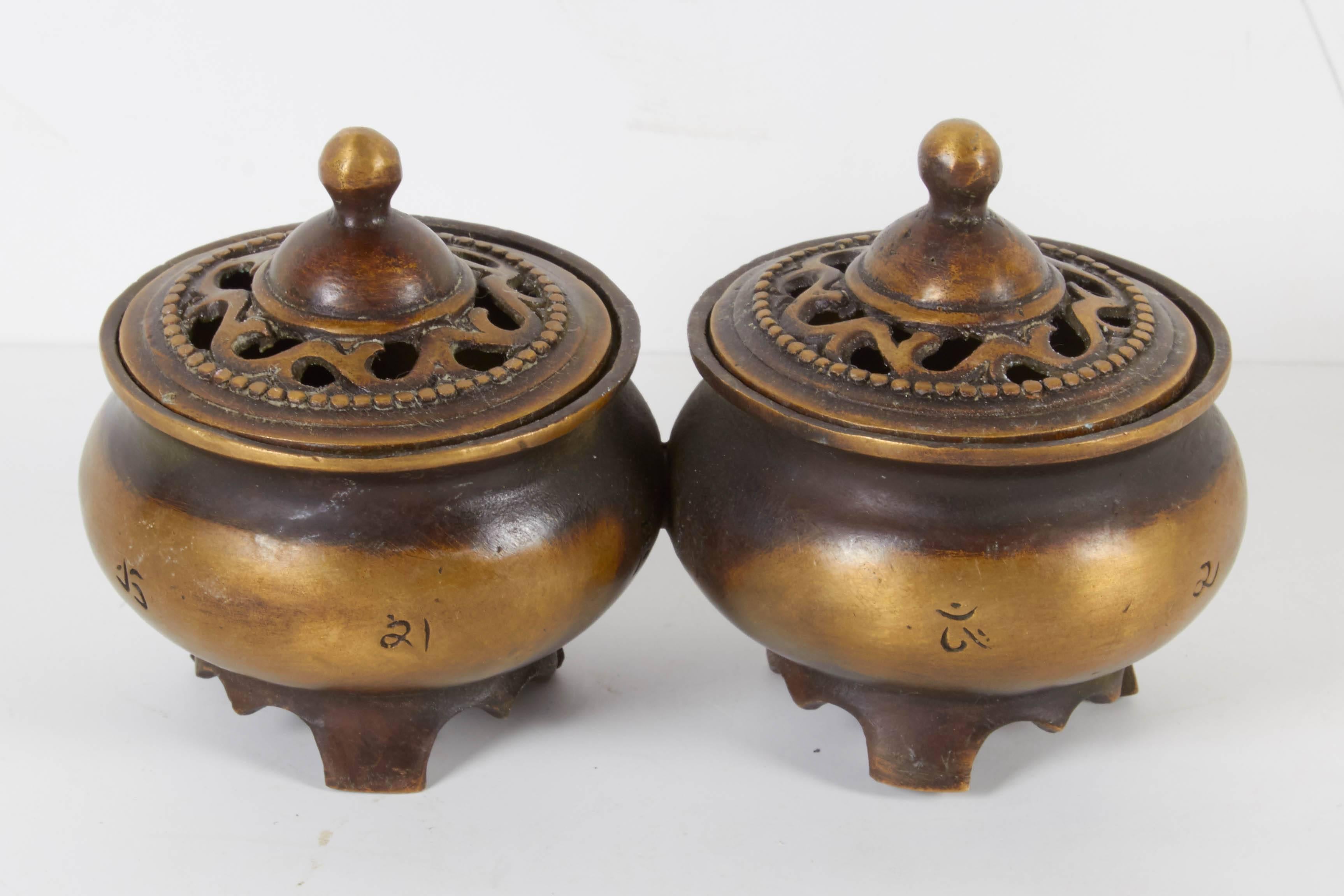 A connected pair of carefully crafted and nicely shaped Tibetan incense burners with decorative lids. These burners beautifully display their many years of handling and use. Very spiritual piece.
W456.