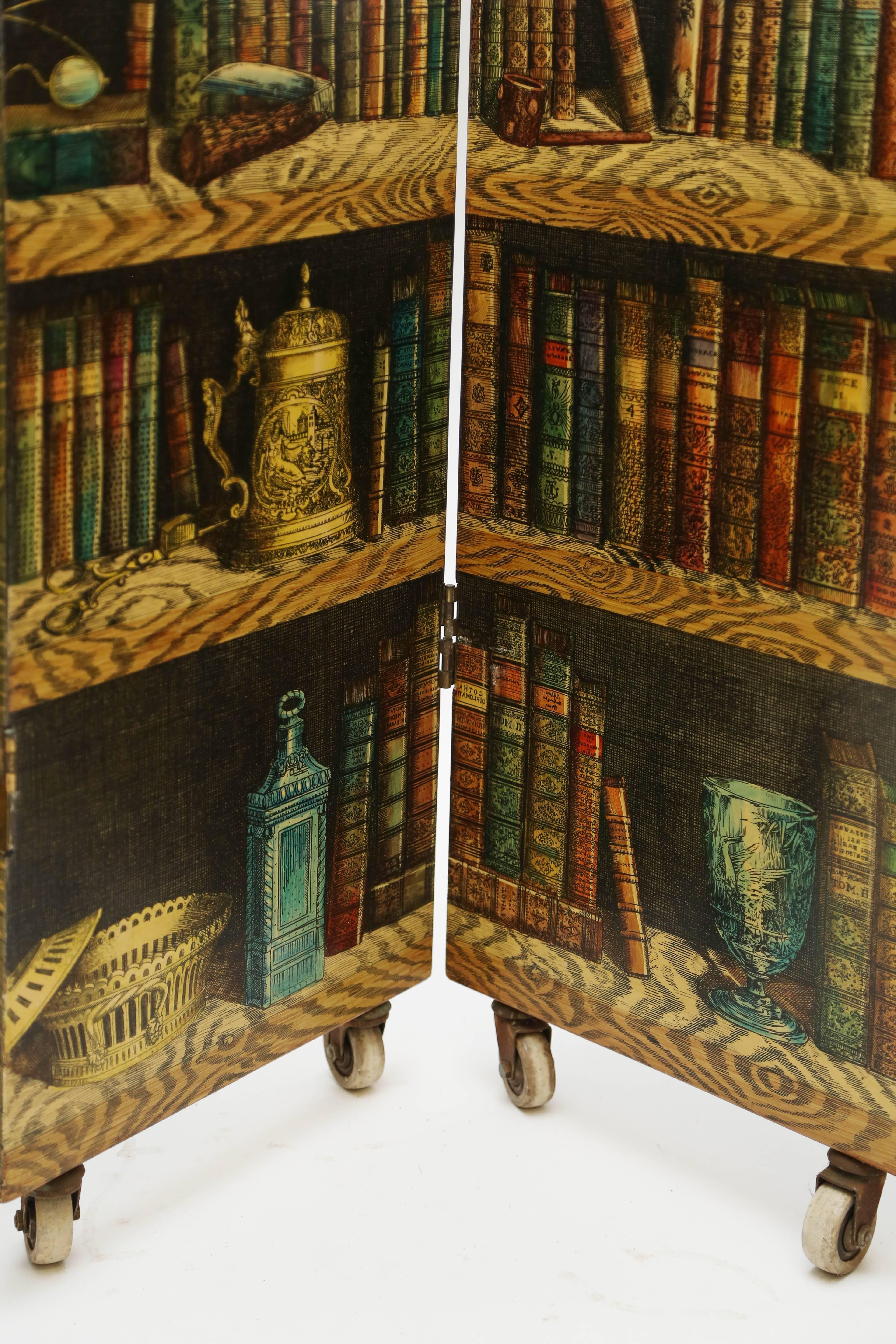 An iconic mid-size screen depicting a library shelf on one side and musical instruments on the verso.
A period example, circa 1954. Measures: 53 1/2