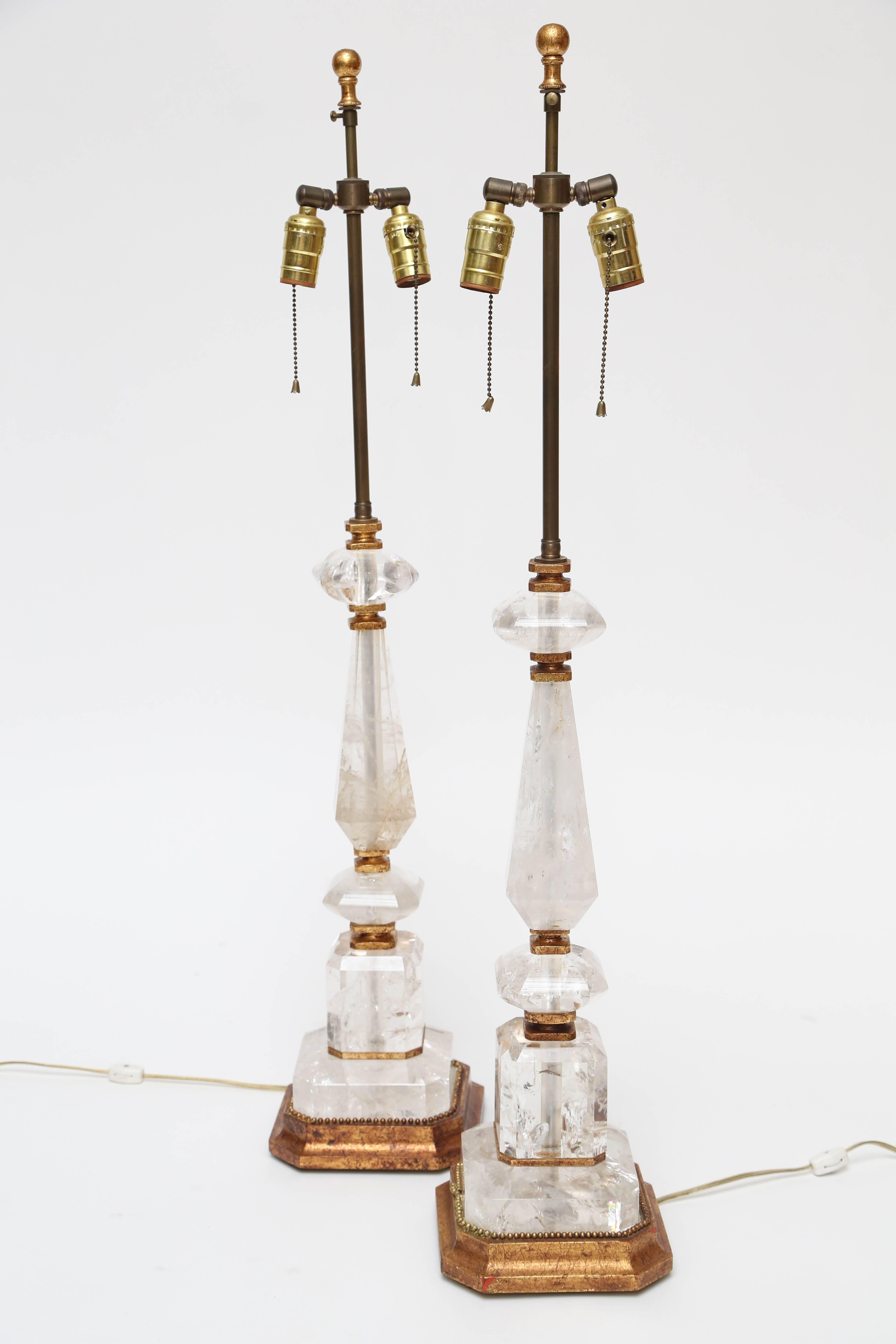 Pair of Rock crystal lamps with gilt fittings.