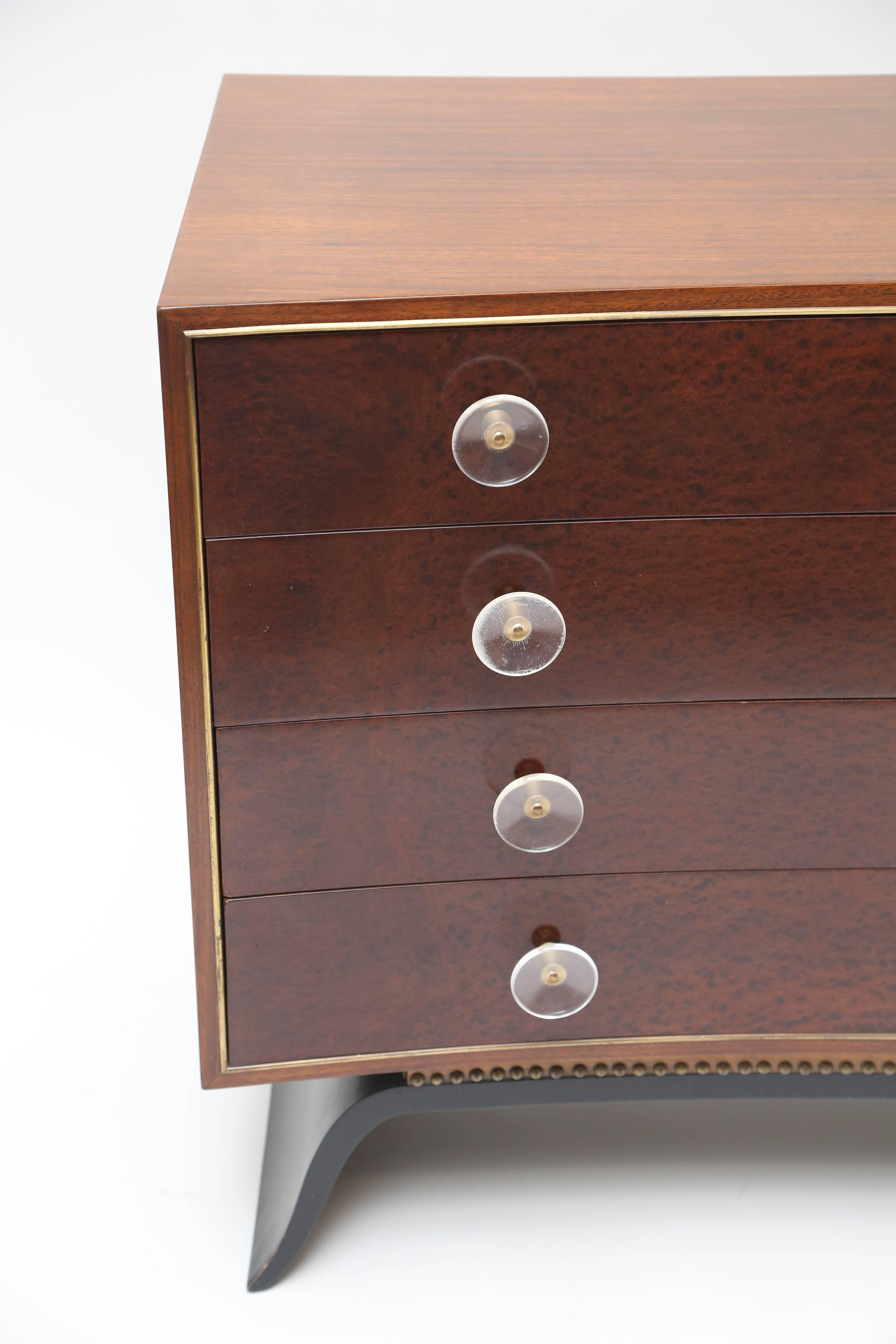 Stylish dresser designerd by Gilbert Rohde model #3920.
Lucite handles with sculptural legs.