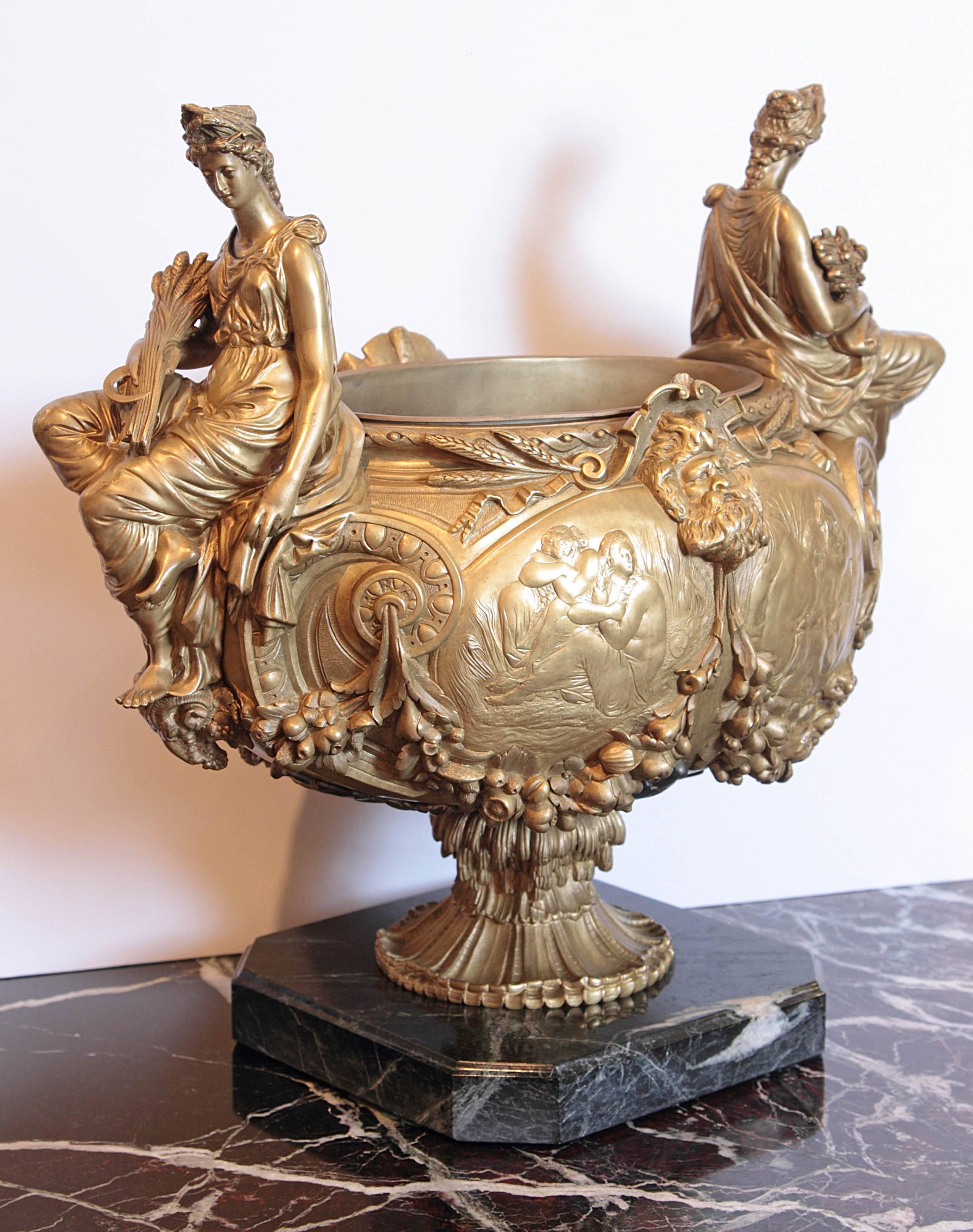 19th century French gilt bronze centerpiece finely cast with figures of Ceres on each side. Fruit swags with Mythological figures in the centre.
