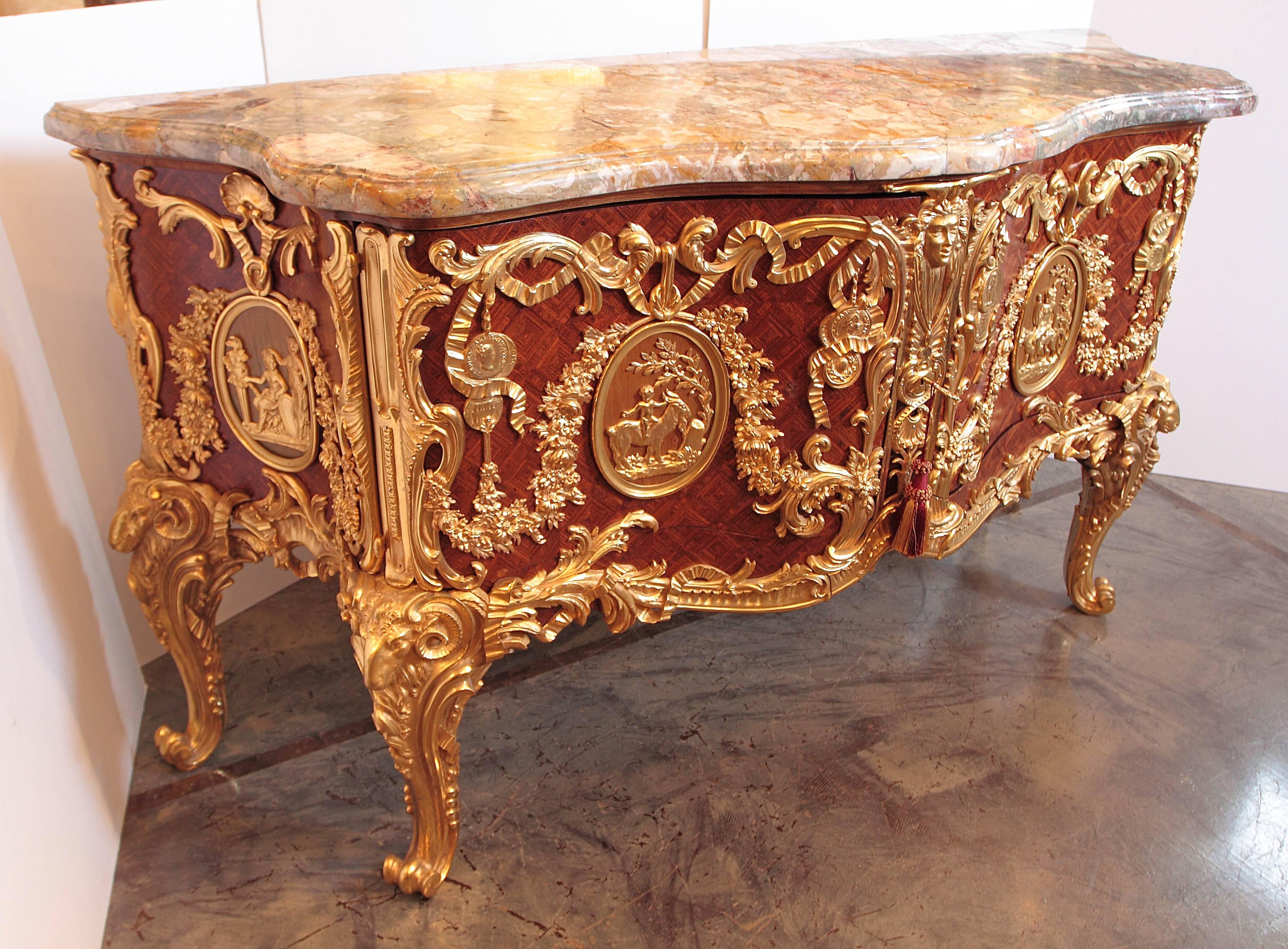 19th century fine commode after Antoine Robert Gaudreaus. Finest quality gilt bronze mounts. Interiors opens with mechanical turning of the key to reveal cabinet drawers for storage. Inquire for more info and pictures.