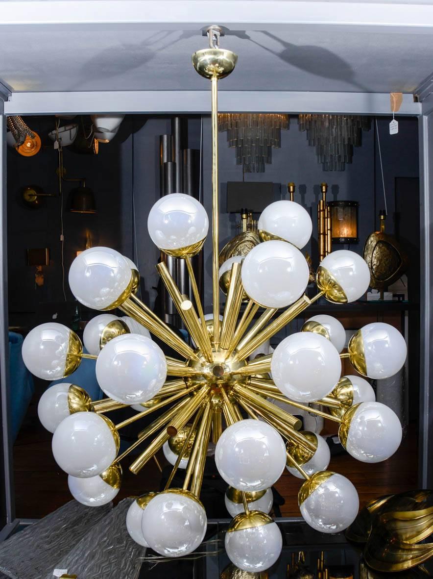 Sputnik chandelier designed by Glustin Luminaires made of brass with iridescent Murano glass globes.