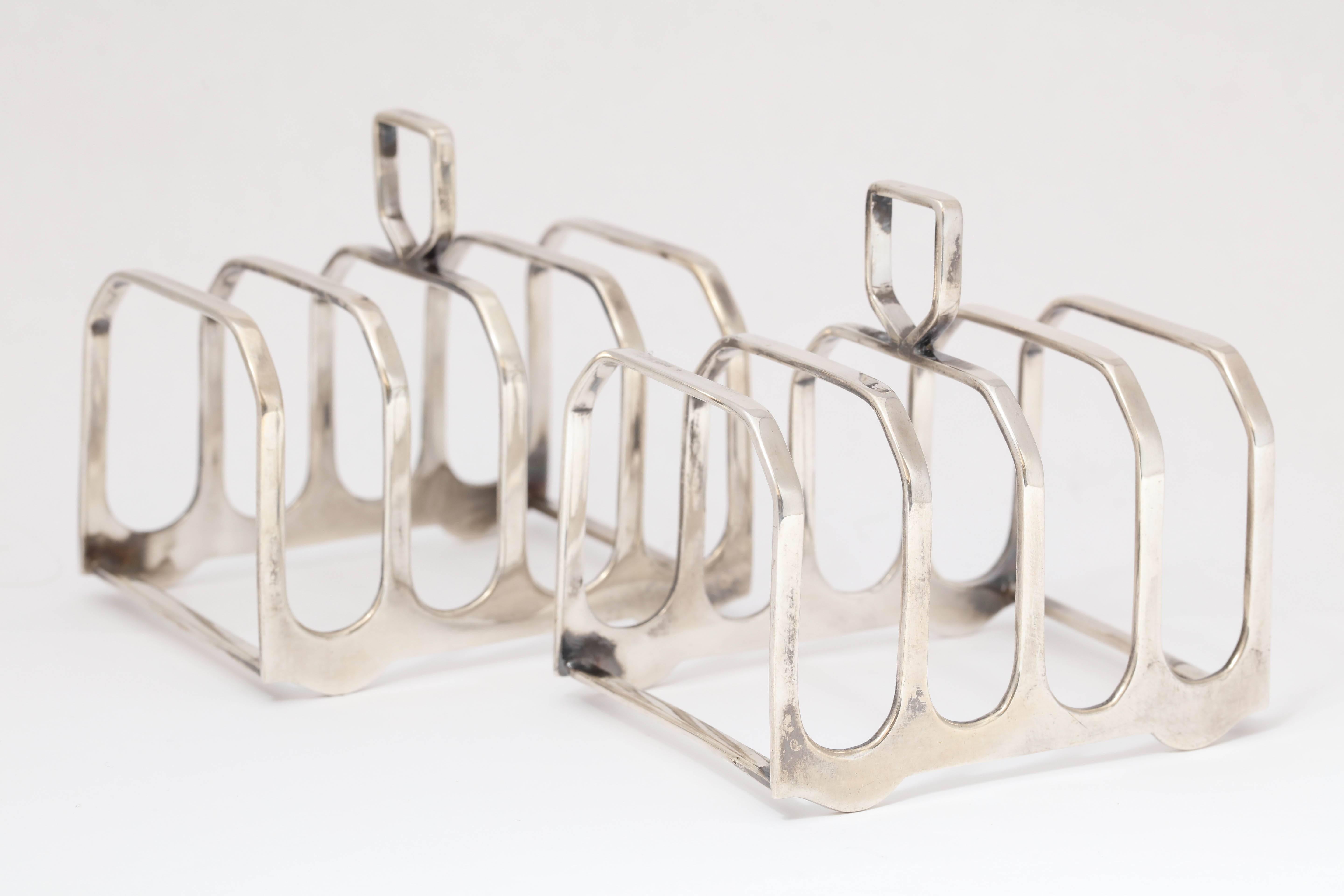 Edwardian-style pair of sterling silver toast racks, Birmingham, England, 1965, Elkington and Co., Ltd. - makers. Measures: Each is 2 3/4 inches long x over 2 inches deep x 3 inches high to top of finial/handle. Weight is 3.865 troy ounces for the