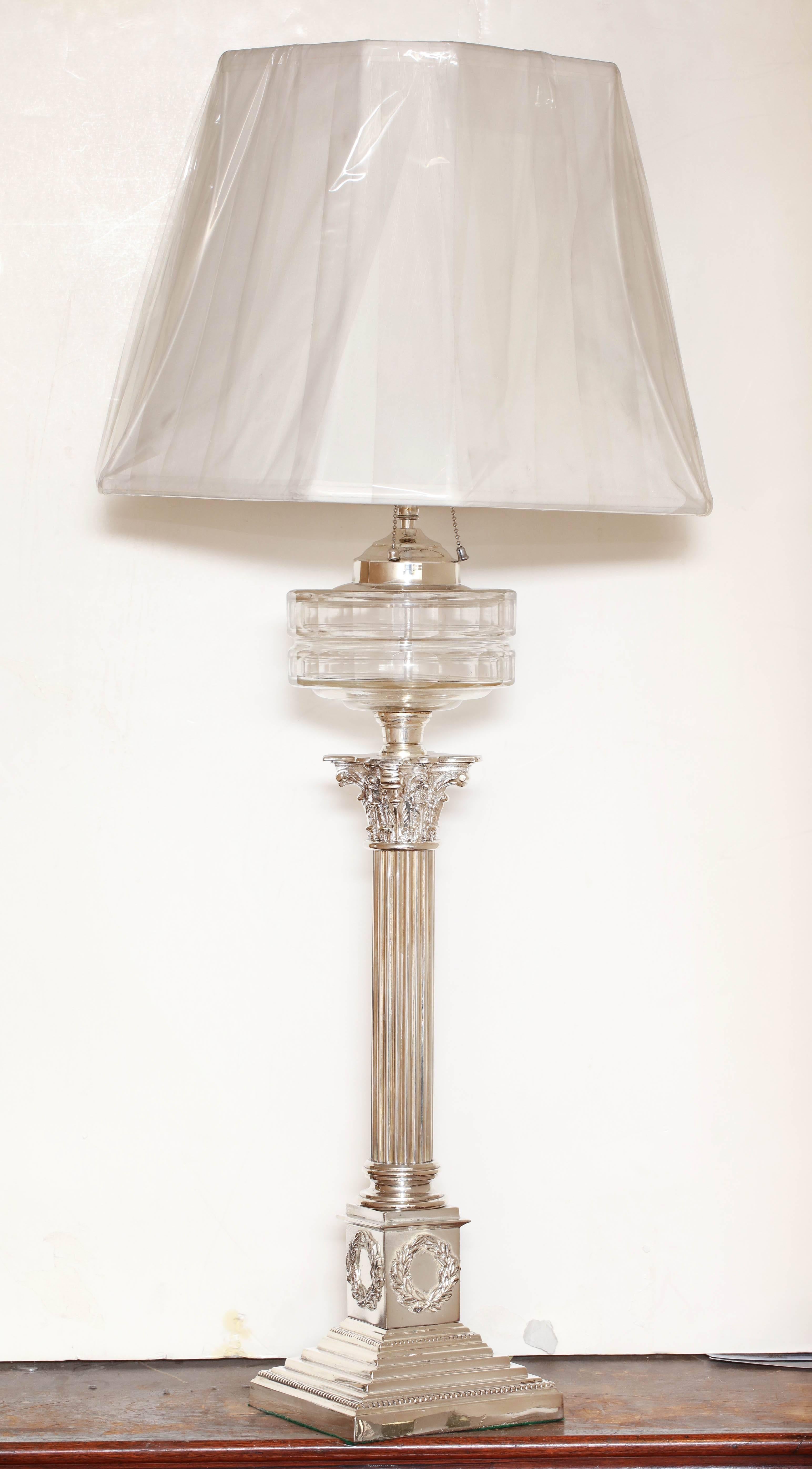 Tall, neoclassical, electrified, column-form oil lamp, England, circa 1880s. Stepped - up square base. 38 inches high Ito top of finial) height is adjustable x 6 1/2 inches wide (at base) x 6 1/2 inches deep (at base). Column itself, without oil