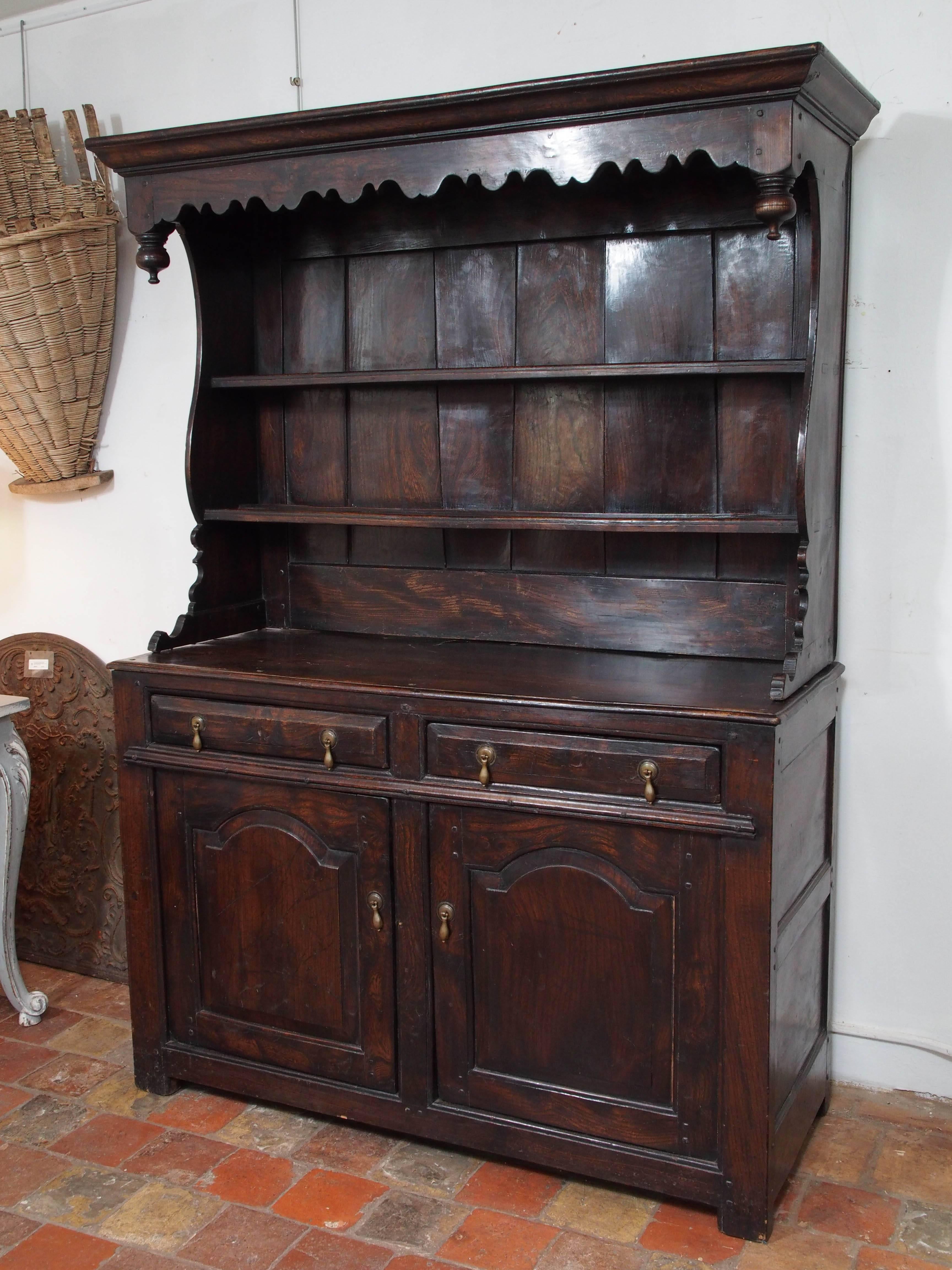 18th century English oak and chestnut cottage hutch with two doors and two drawers, circa 1780.