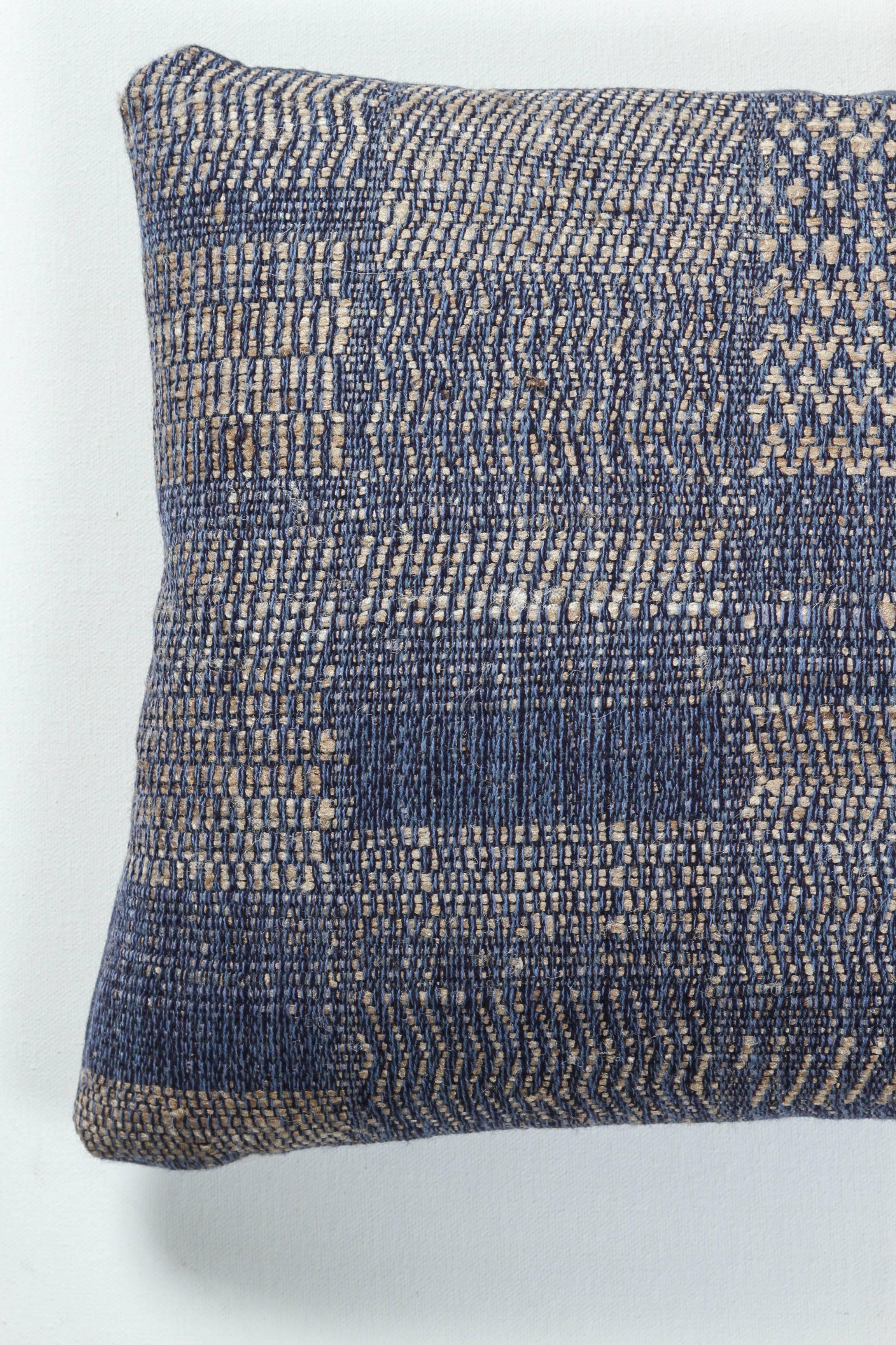 A contemporary line of cushions, pillows, throws, bedcovers, bedspreads and yardage hand woven in India on antique Jacquard looms. Handspun wool, cotton, linen and raw silk give the textiles an appealing uneven quality.

This wool and raw tussar