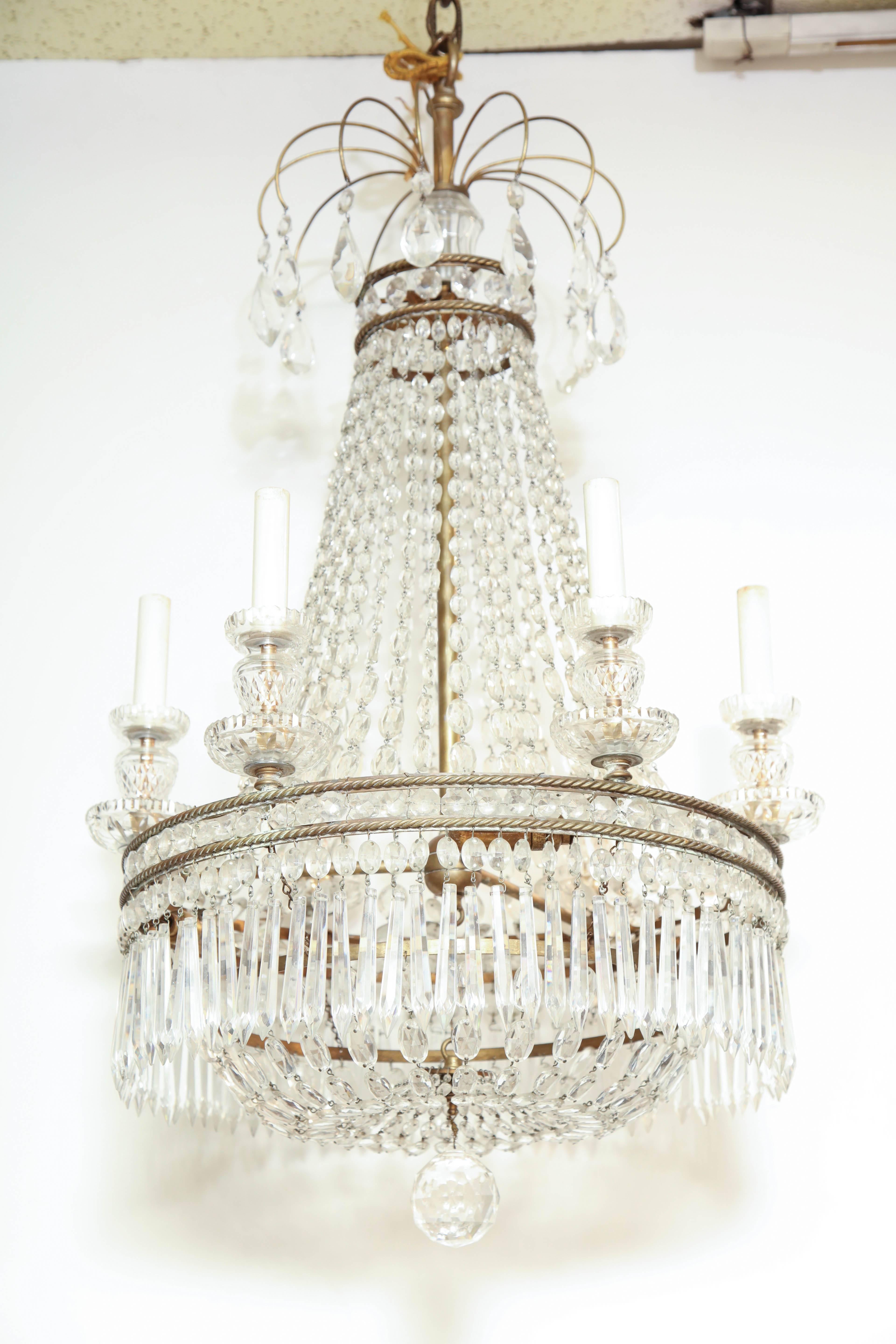 French Louis XVI style crystal and bronze six-light chandelier.