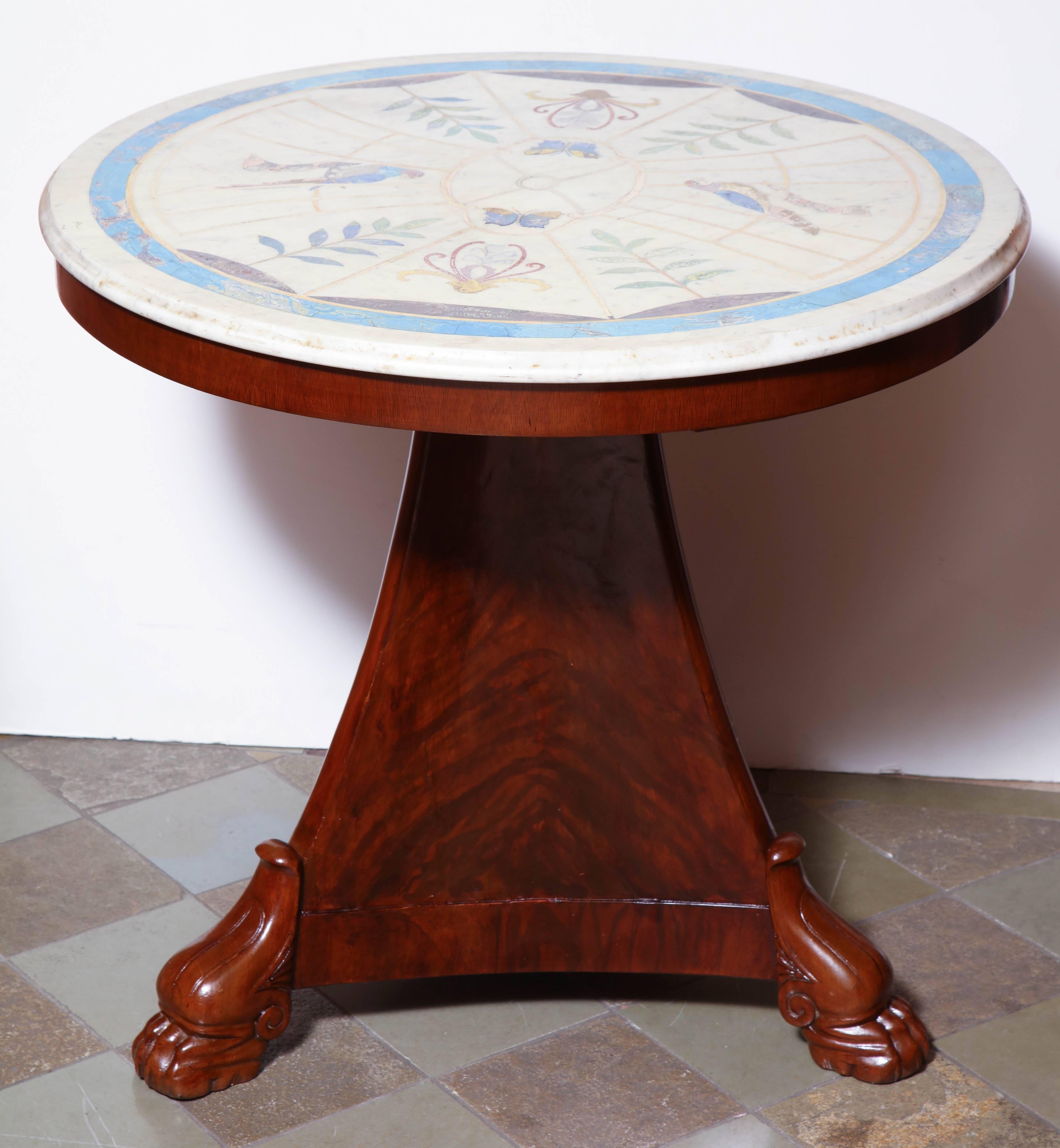 French Empire marble-top gueridon with a figured mahogany tripartite paw foot base.