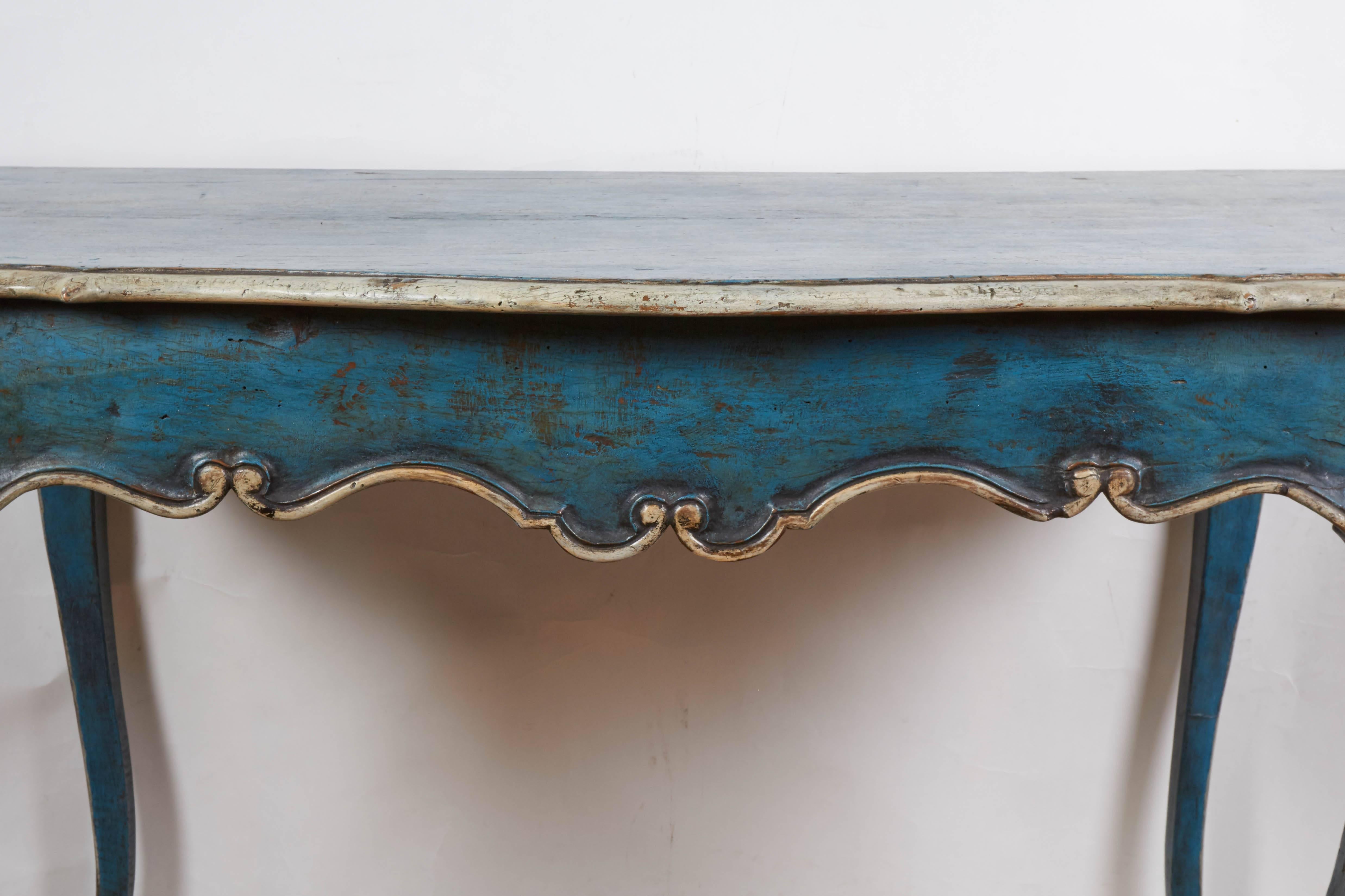 A Louis XV style painted side table, turquoise painted with cabriole foot and scalloped apron, with cream colored trim.