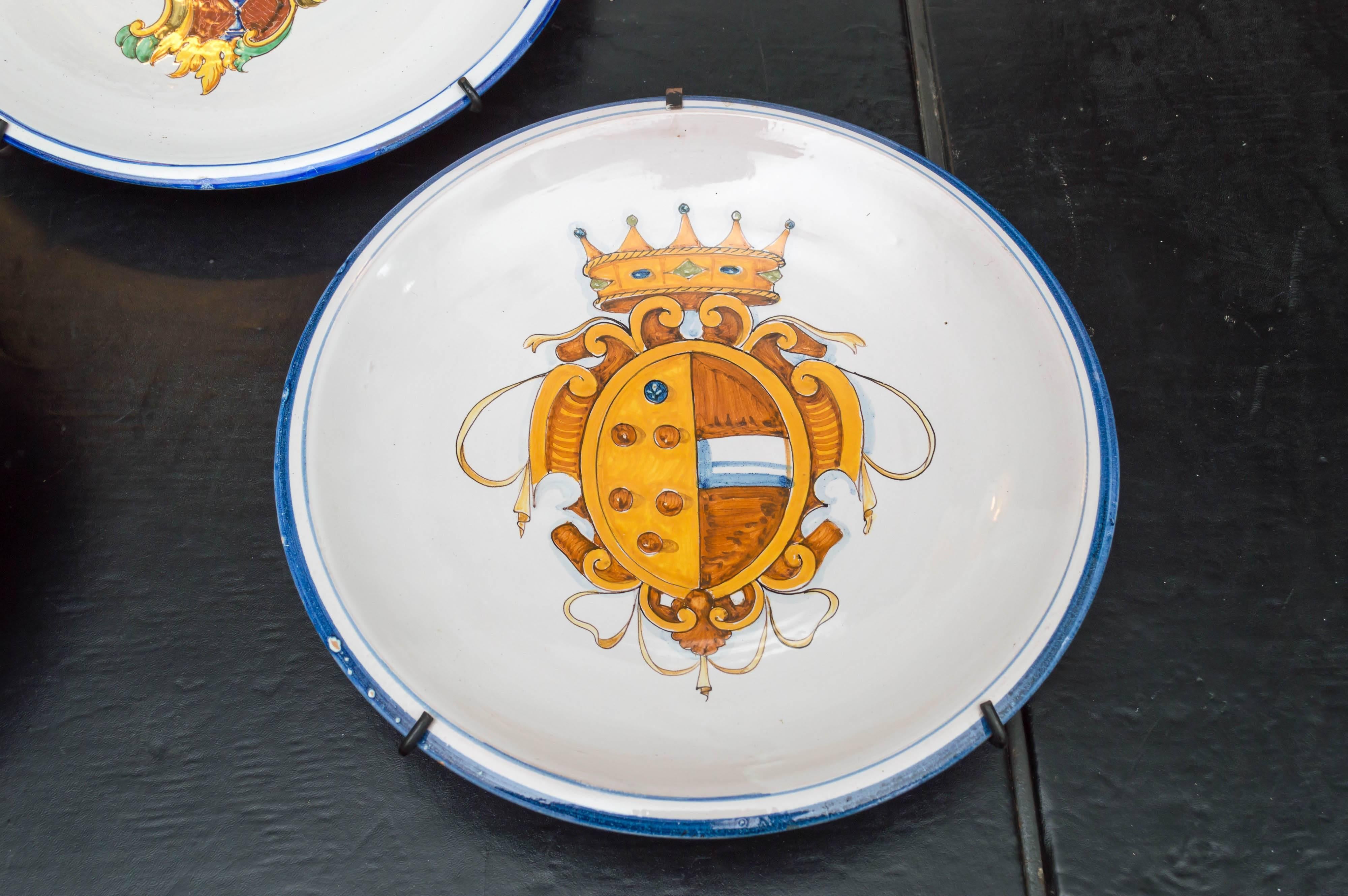 A set of three, late 19th century. Italian Majolica plates / chargers. Decorated with armorial crests of three different designs. Very good drawing and precise application of glazes. Two plates are signed M. Cupi 1892. These two have a deeper bowl