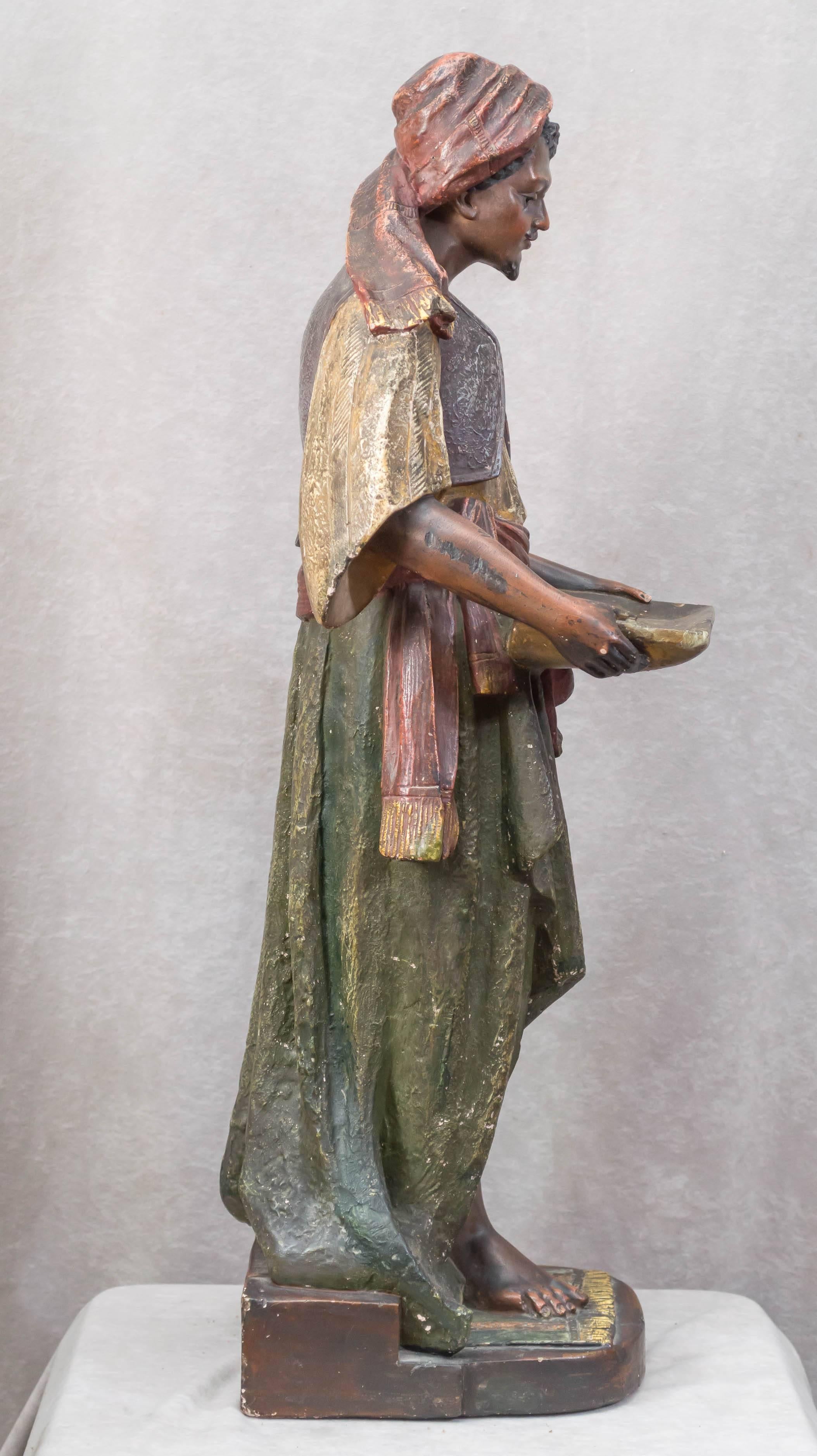 Early 20th Century Large Plaster Sculpture of an Arab Merchant Holding a Tray