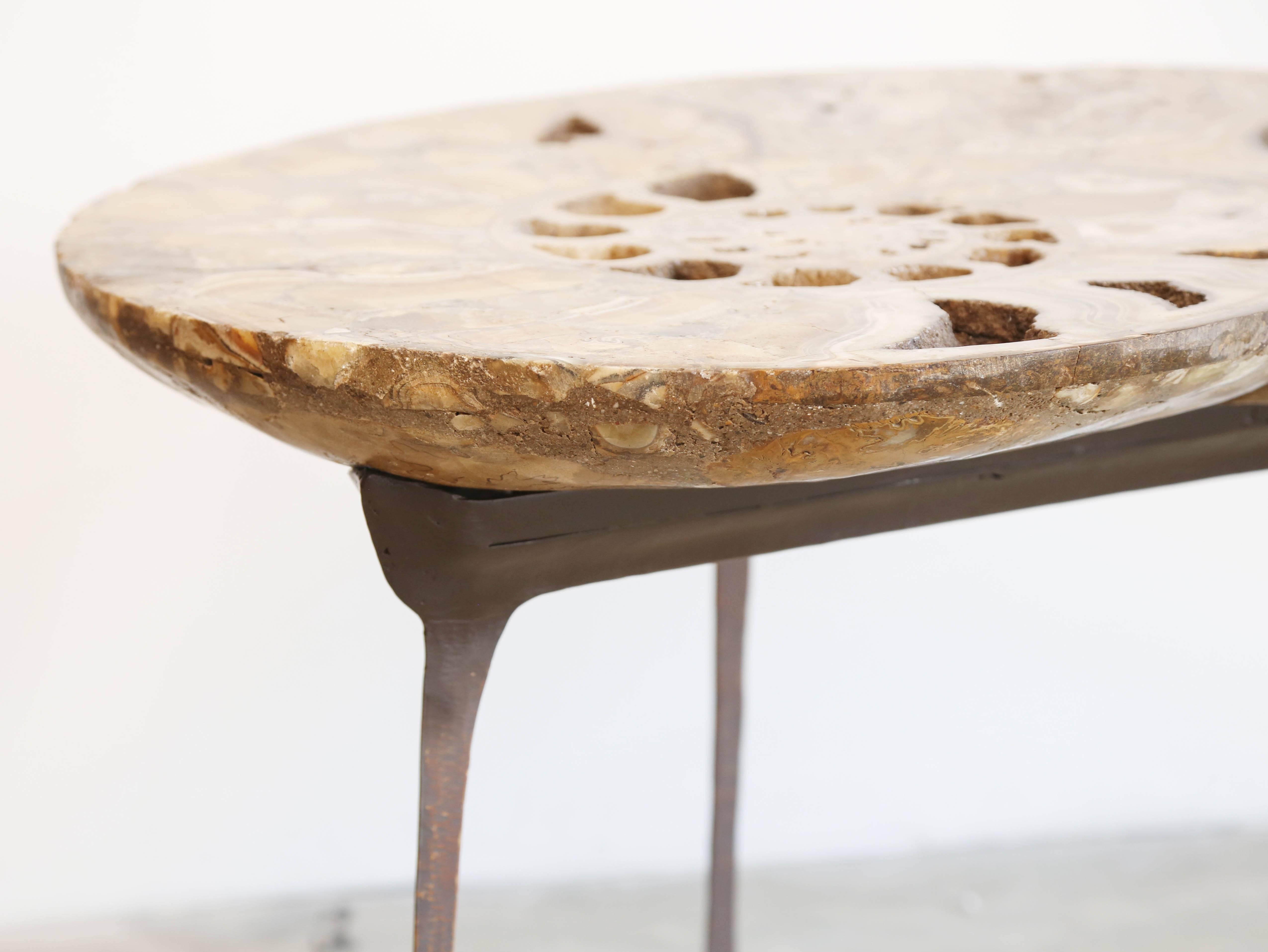 Exceptional unic coffee or sofa table, a fossil stone of ammonite, standing on a bronze base.
Natural fossil stone.
         