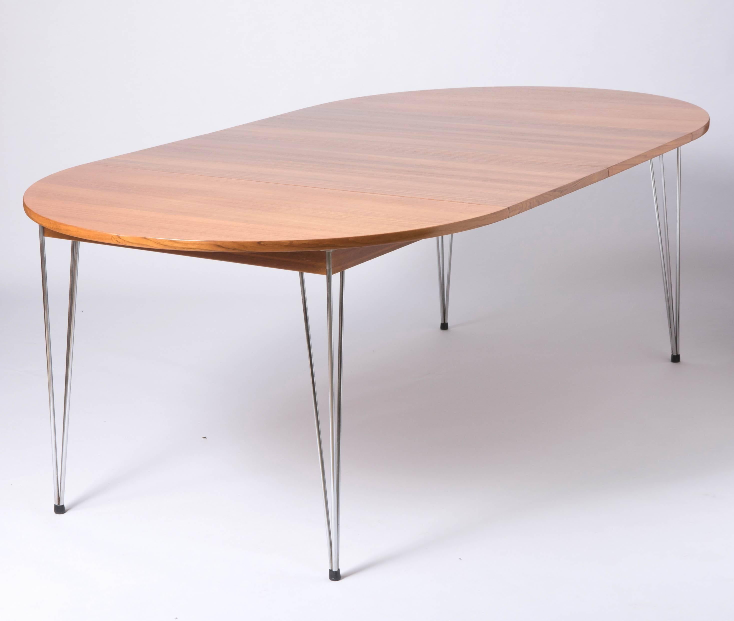 A Scandinavian Teak dining table By Hans Brattrud.
The extending top with a hidden two part leaf. Upon a chromium plated base.
Ebonized stretcher.
Unmarked.
Norwegian, 
circa 1950
Measures: 73 cm high x 137 cm wide (198 cm extended) x 92 cm deep.
  