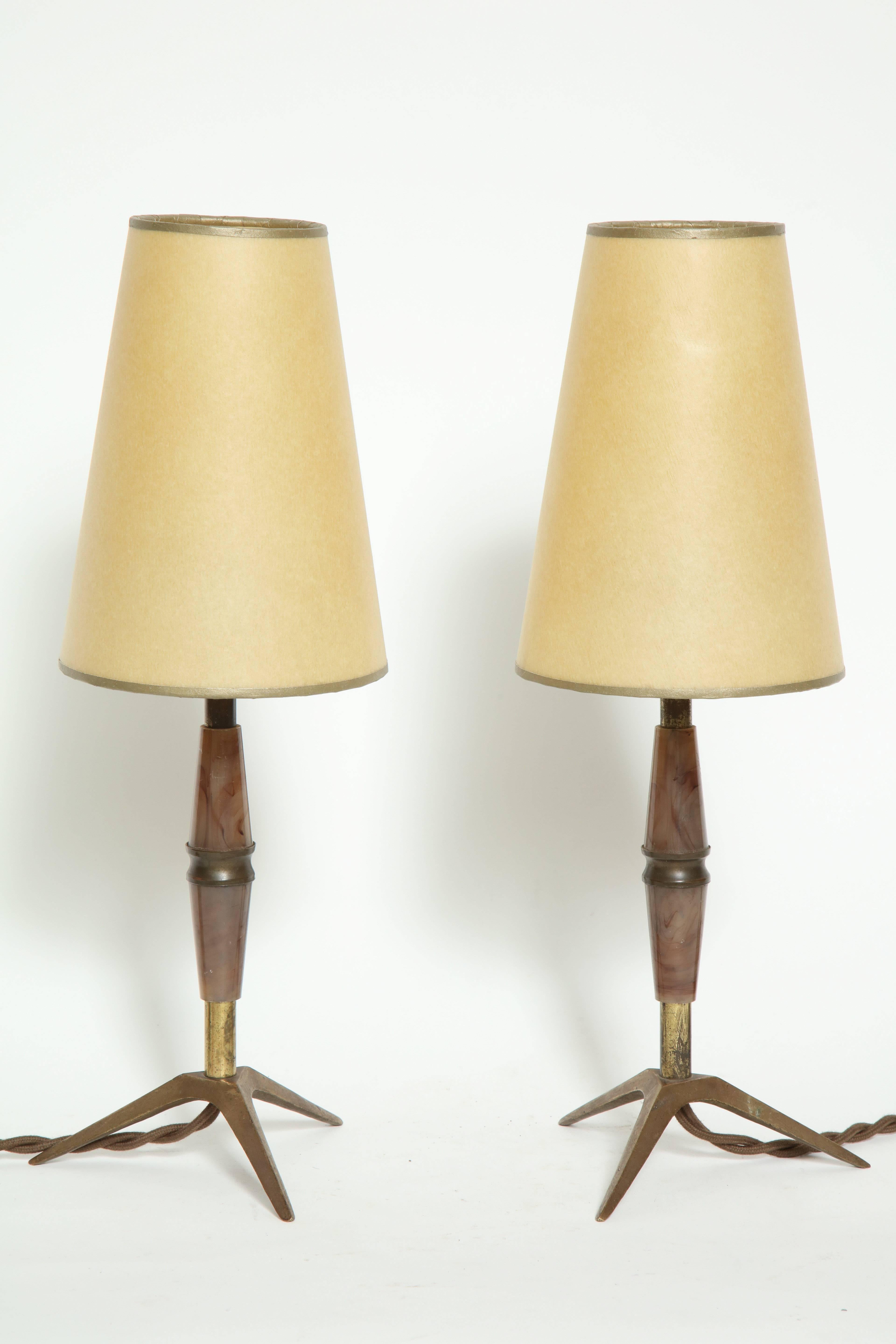 Elegant pair of brass and bakelite table lamps, ideal for a bedside or an accent lamp.