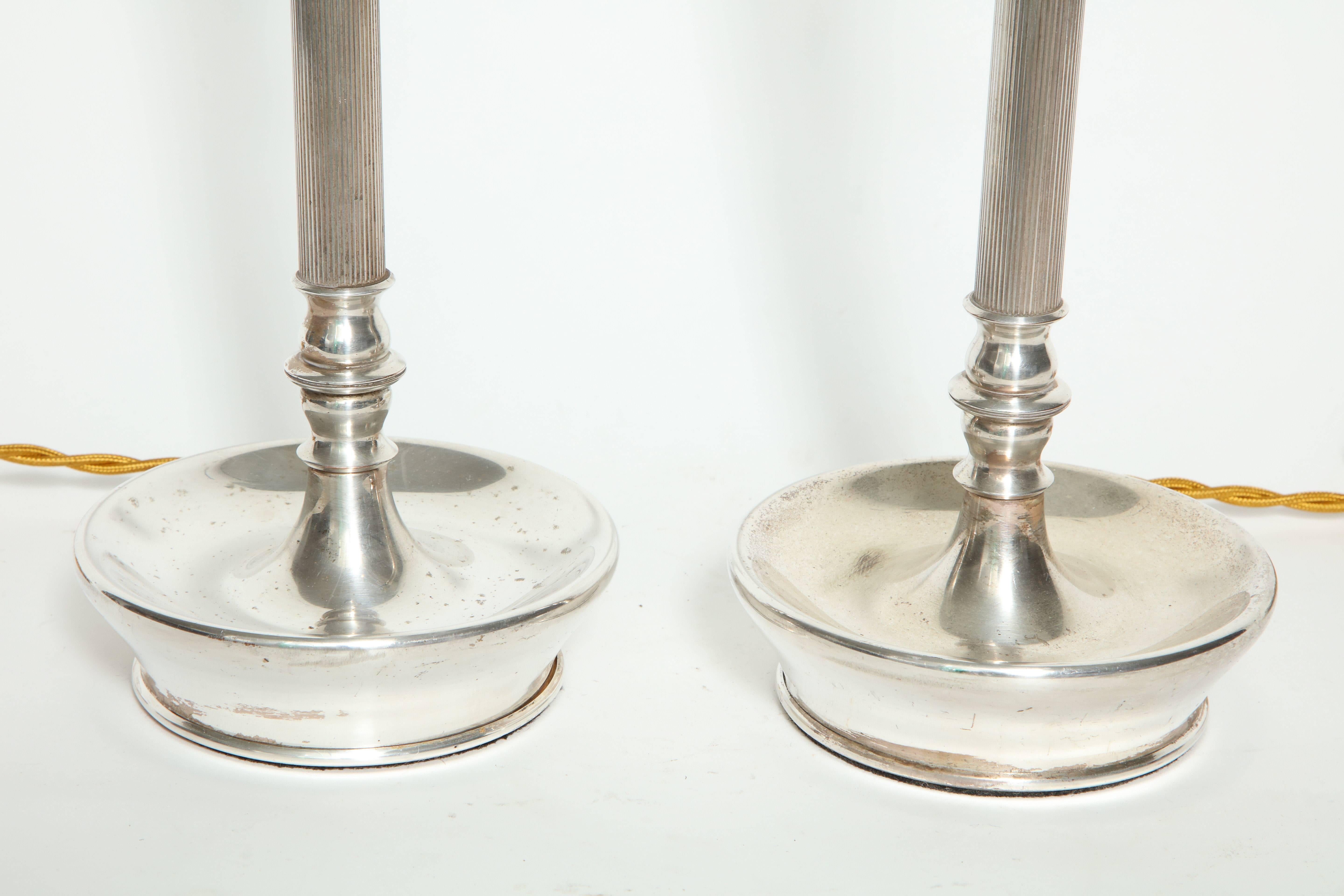 Pair of silver plated table lamps with original pull sockets.