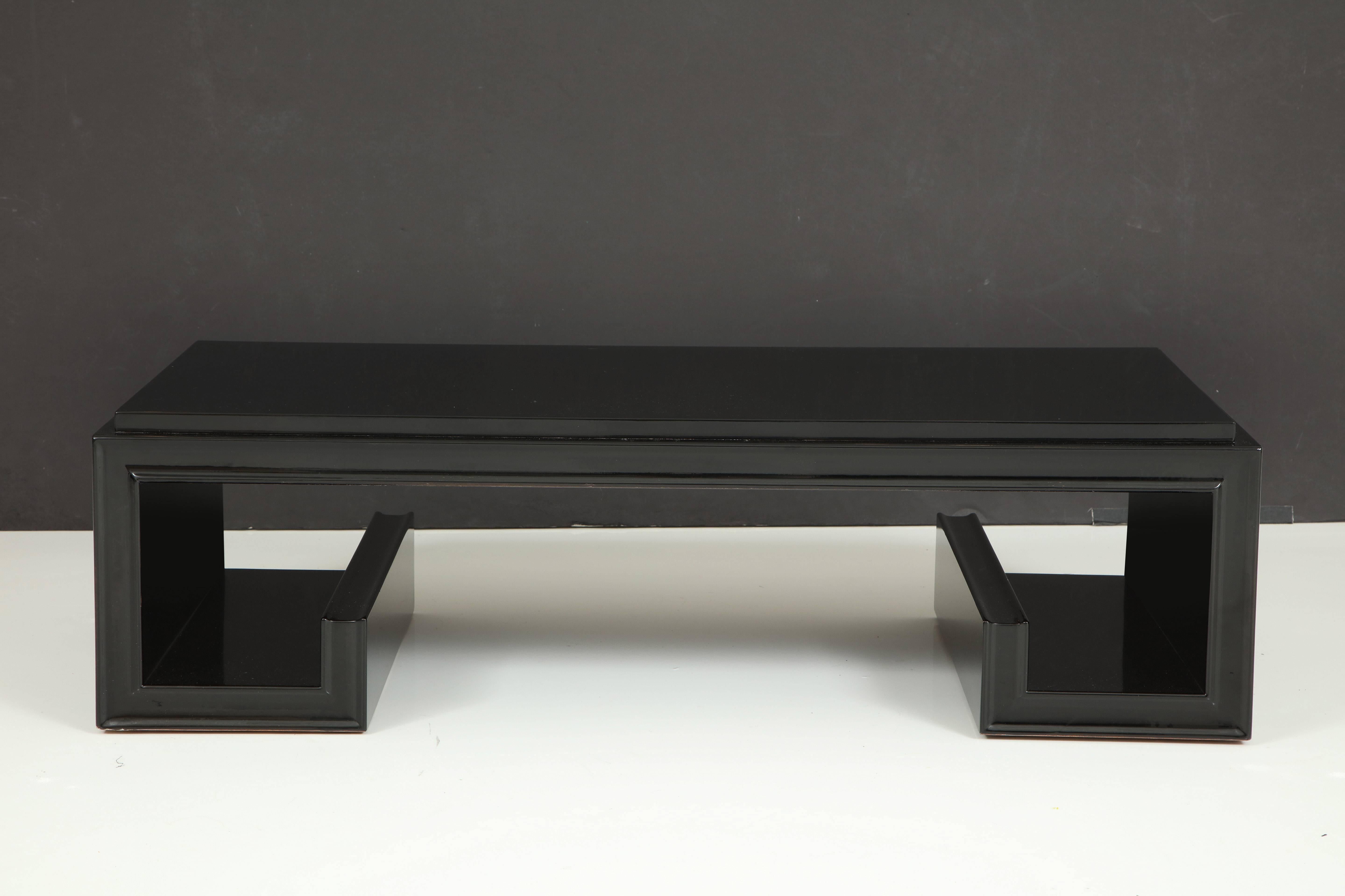 Beautiful Greek Key coffee table by James Mont.
This elegant table which is absolutely stunning, now that it has been newly refinished in a very high gloss black lacquer.
The table is branded on the bottom 