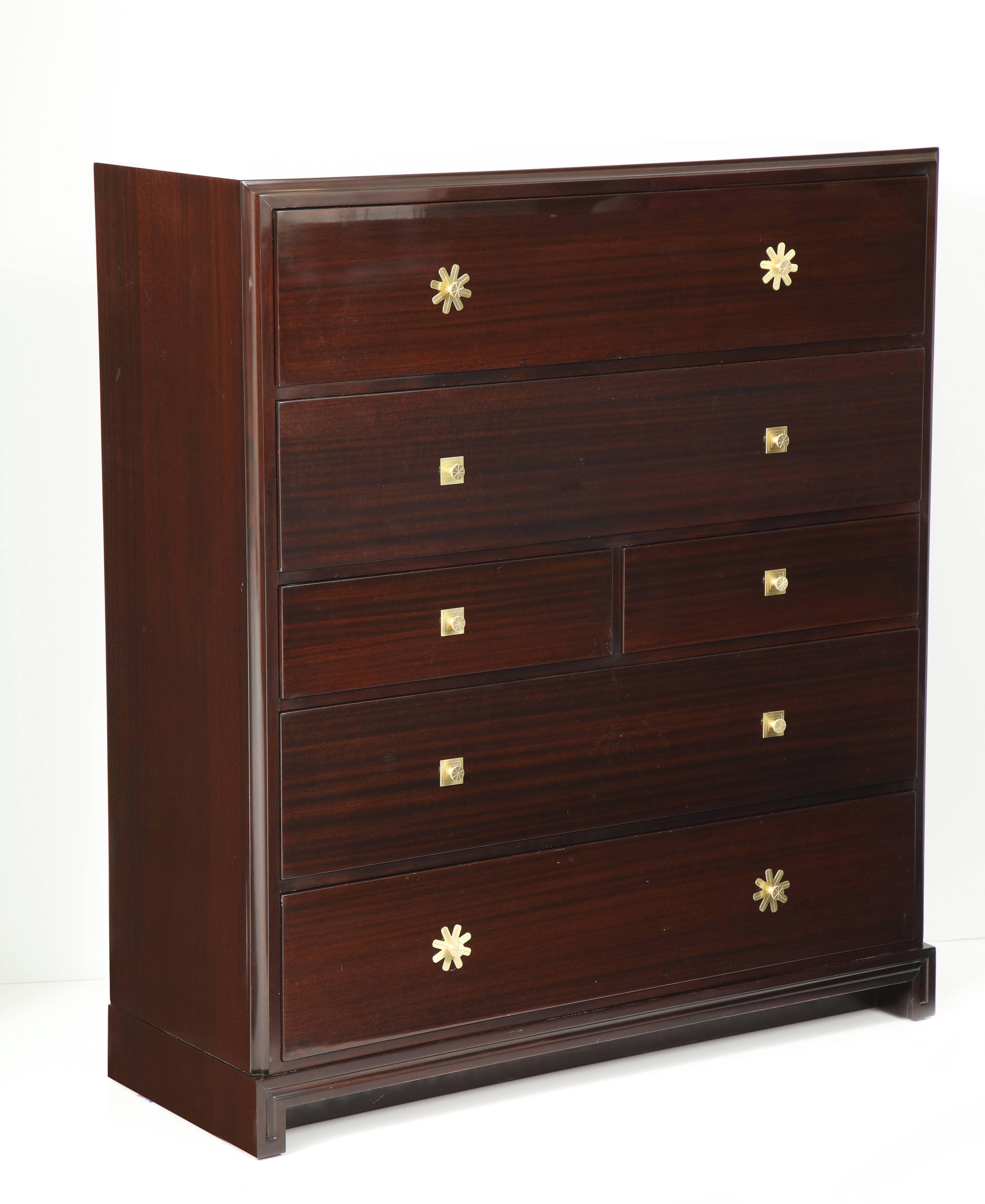 Custom ordered pair chest of drawers in solid mahogany with iconic brass pulls all designed by Tommi Parzinger/Parzinger originals. Each chest has four ample drawers and two half drawers. Each chest stands at an impressive 54 inches tall. Restored