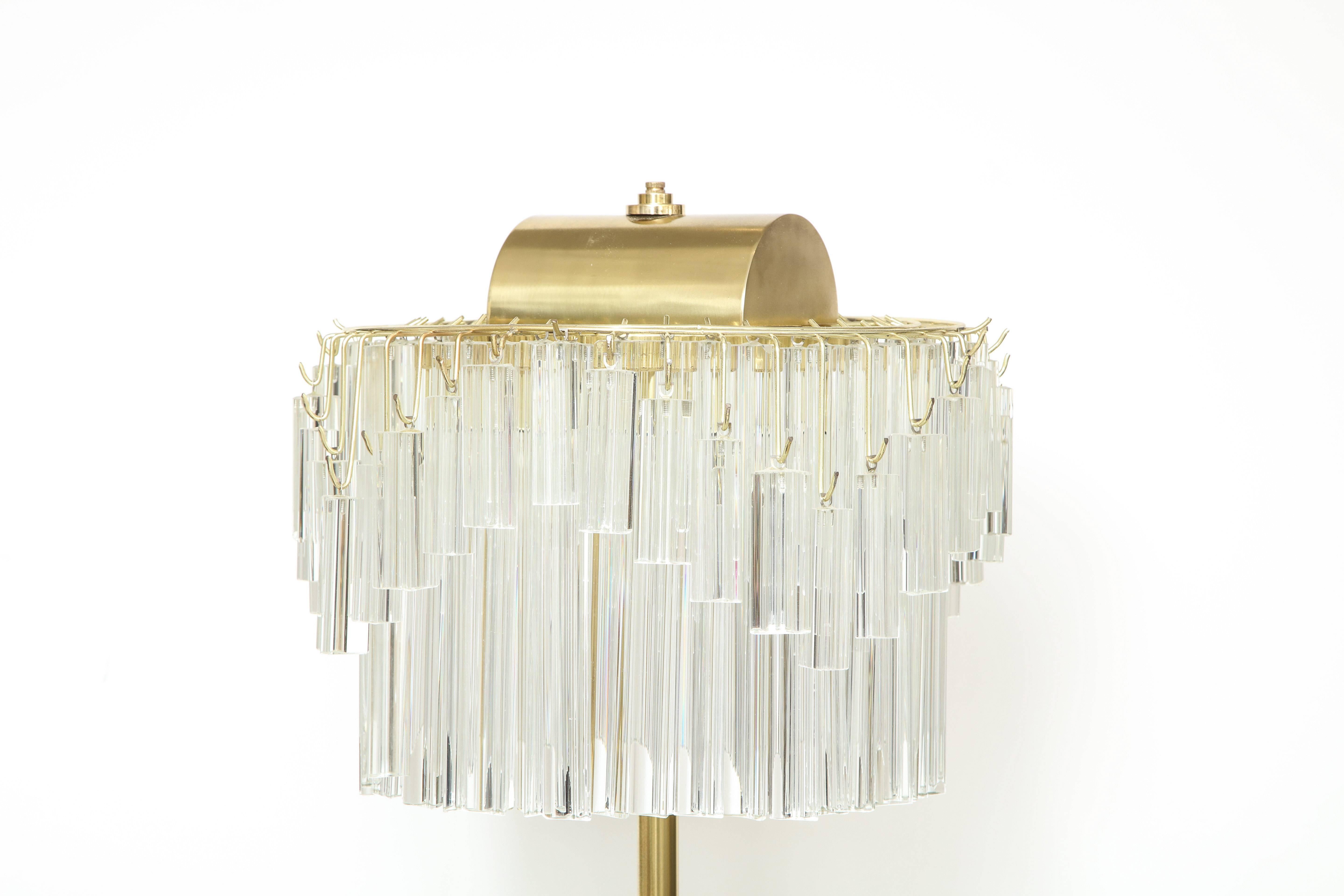 Venini crystal triedi prism floor lamp. Crystal body supported by a brass pole and white marble base. Floor lamp utilizes six light sources using candelabra type bulbs. Rewired for use in the USA. Originally a special order and sold thru Camer