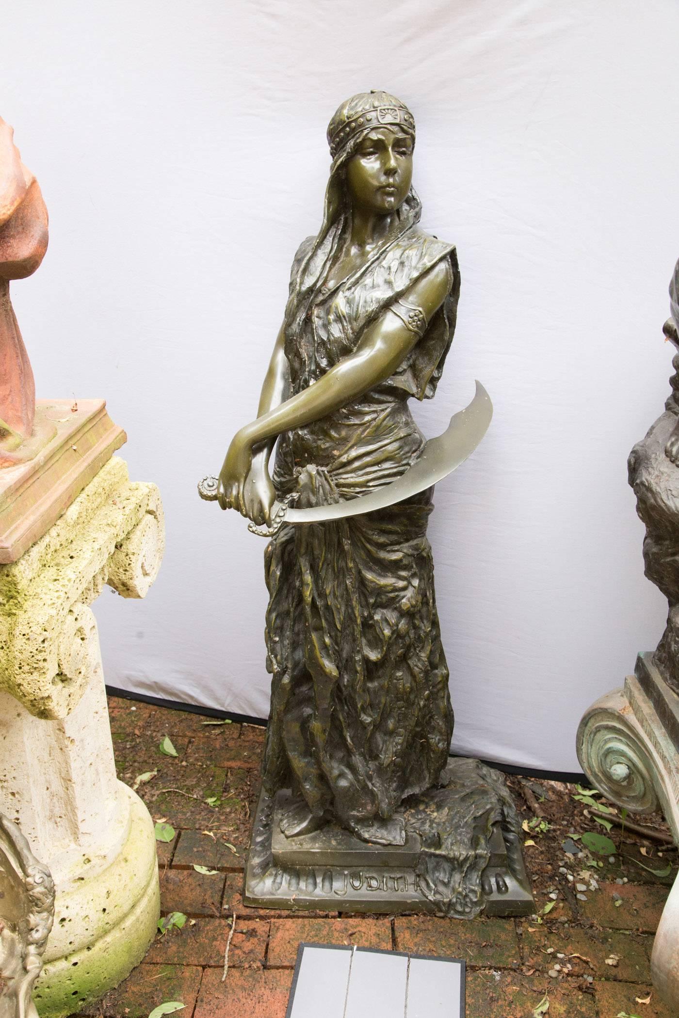Judith stands upon an integral base, she wears a cloche type hat and carries a simitar in her right hand.
Base has the signature E. Villanis (Emmanuel Villanis 1858-1914)
This is a reproduction of his work, cast in the late 20th century. Foundry