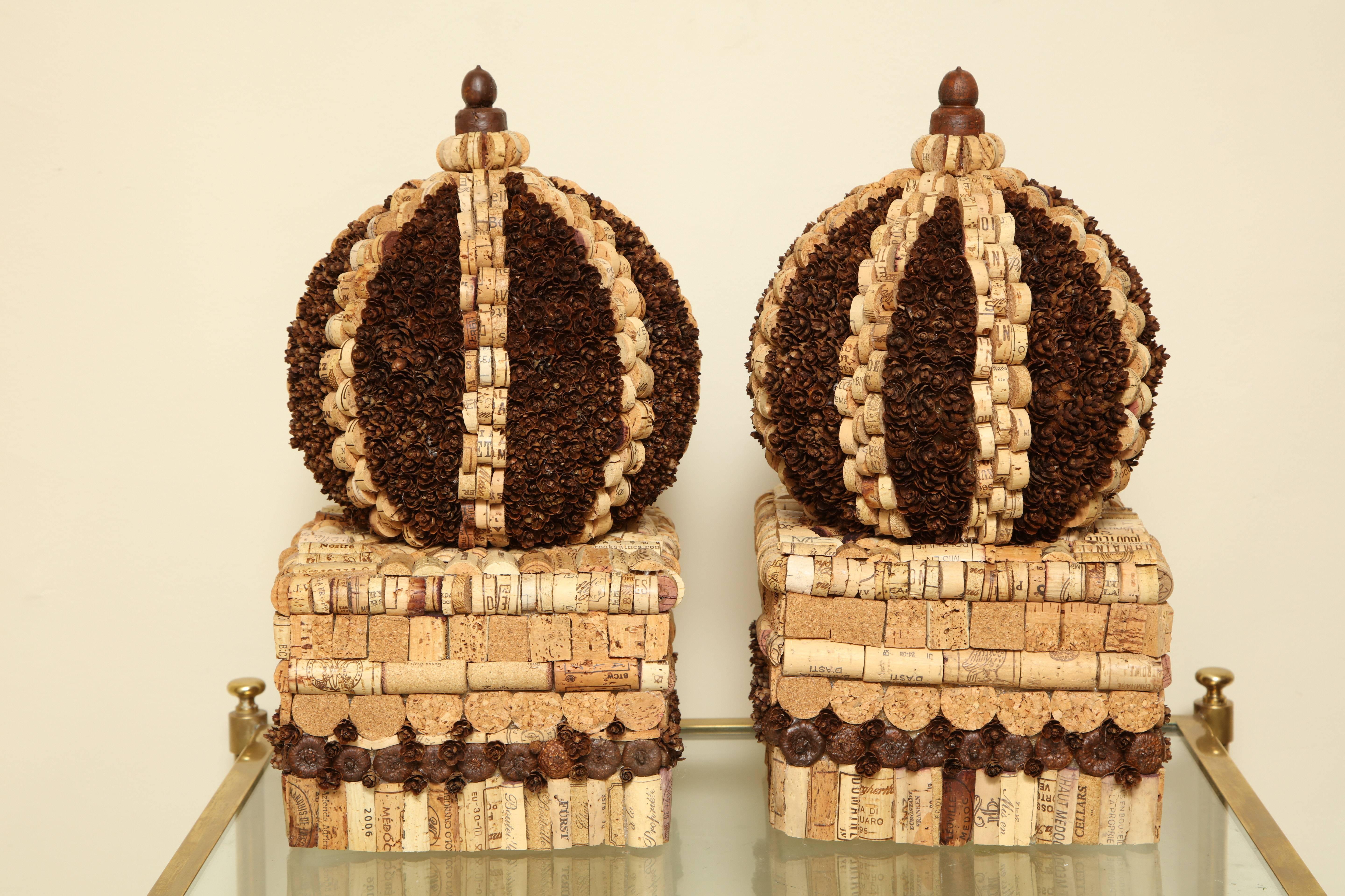 With a nod to Tramp Art, McEvoy takes spliced wine bottle corks, pinecones, and acorns to build out her architectural creations in her signature color palette of natural, white, black and red. 

Marian McEvoy lived in Paris from 1975 to 1990,