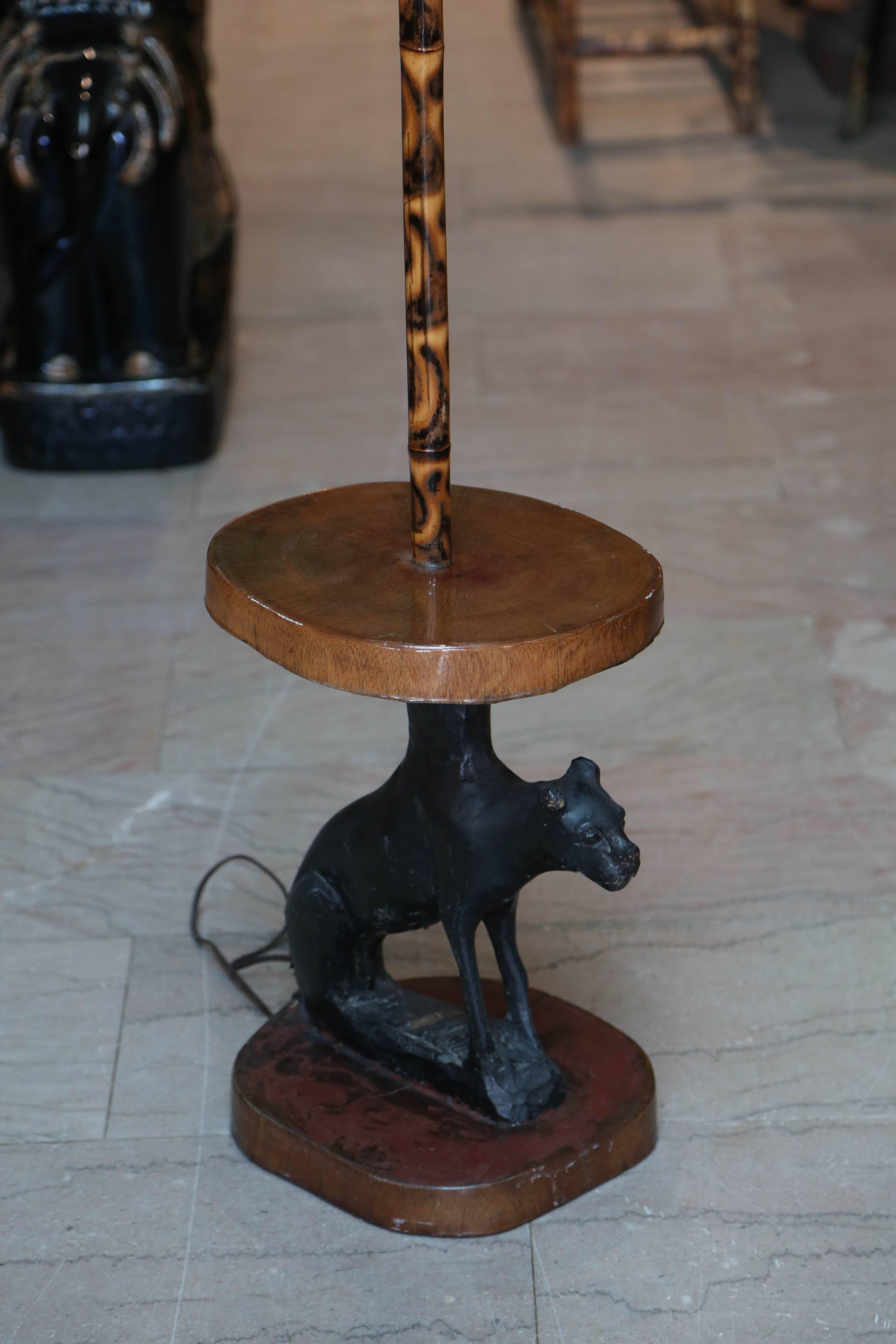 Unusual hand-carved base with the figure of a dog.