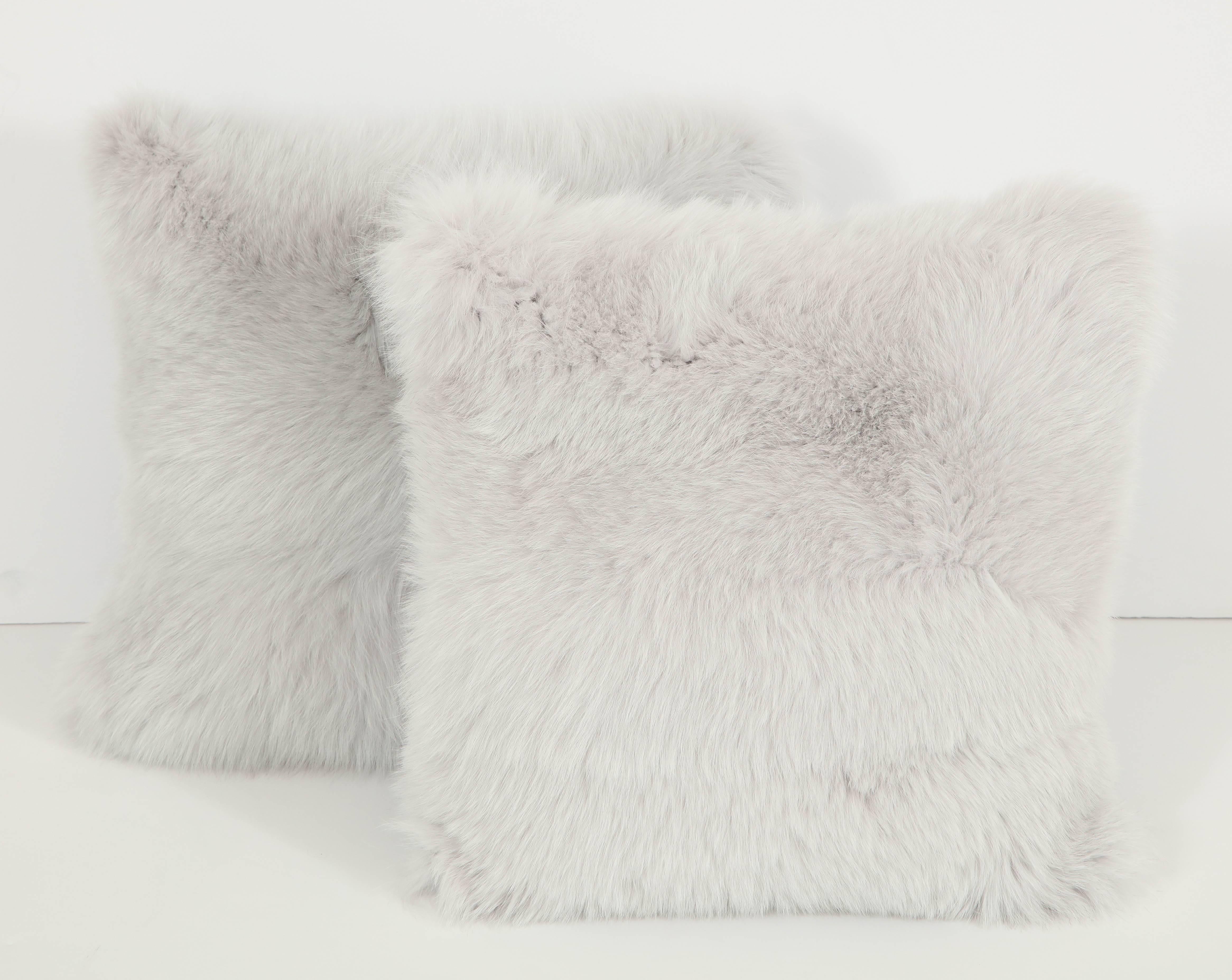 Add a bit of glamour to a room with this pair of fox fur pillows in a silvery white, backed in a lovely soft blue.