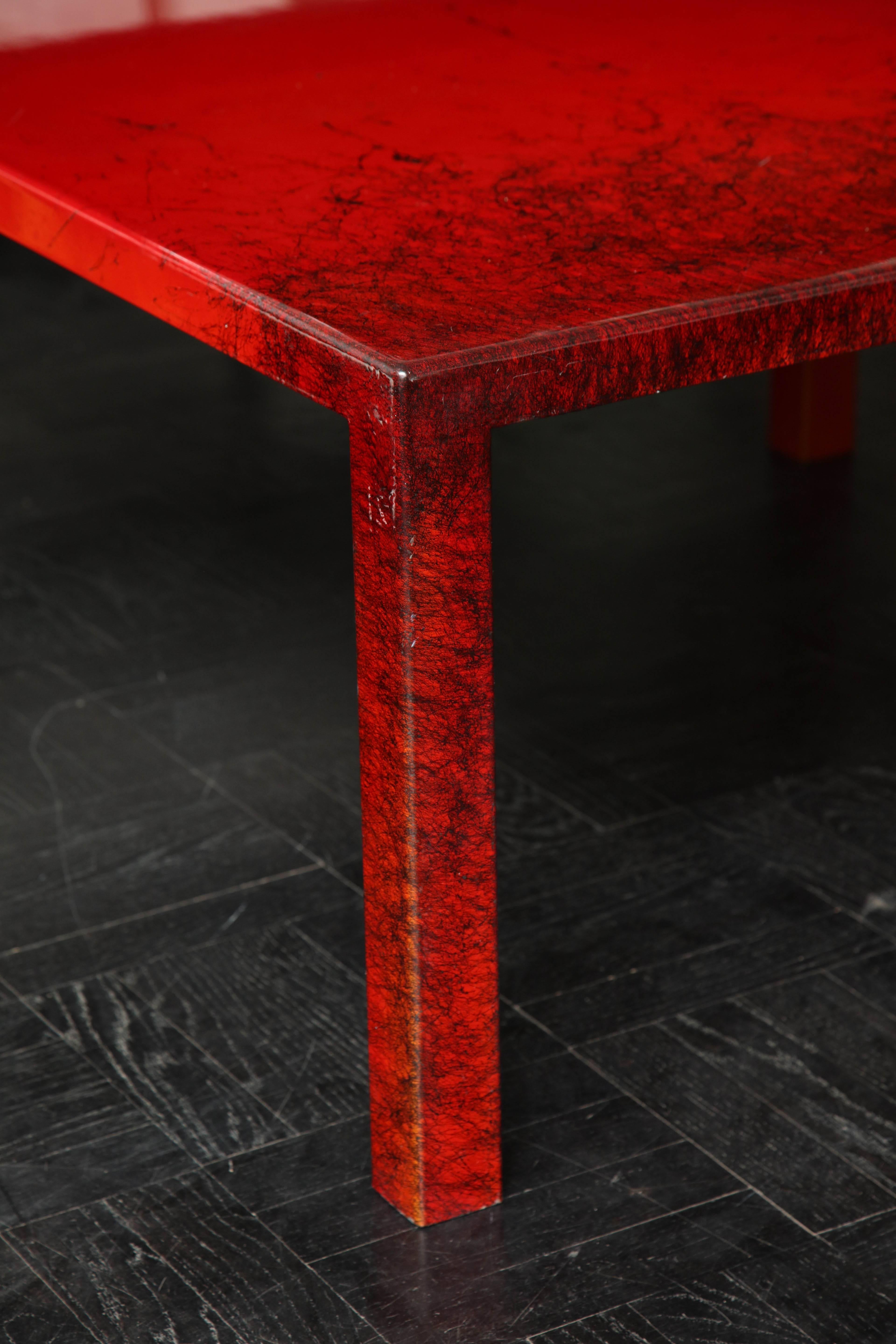Contemporary red lacquered coffee table, square leg.