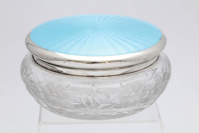 Large, Art Deco, sterling silver and robin's egg blue guilloche enamel - mounted etched crystal powder jar, American, circa 1920s-1930s. Enamel shimmers in the light. Crystal has lovely, floral etching and an incised star on underside. Underside of