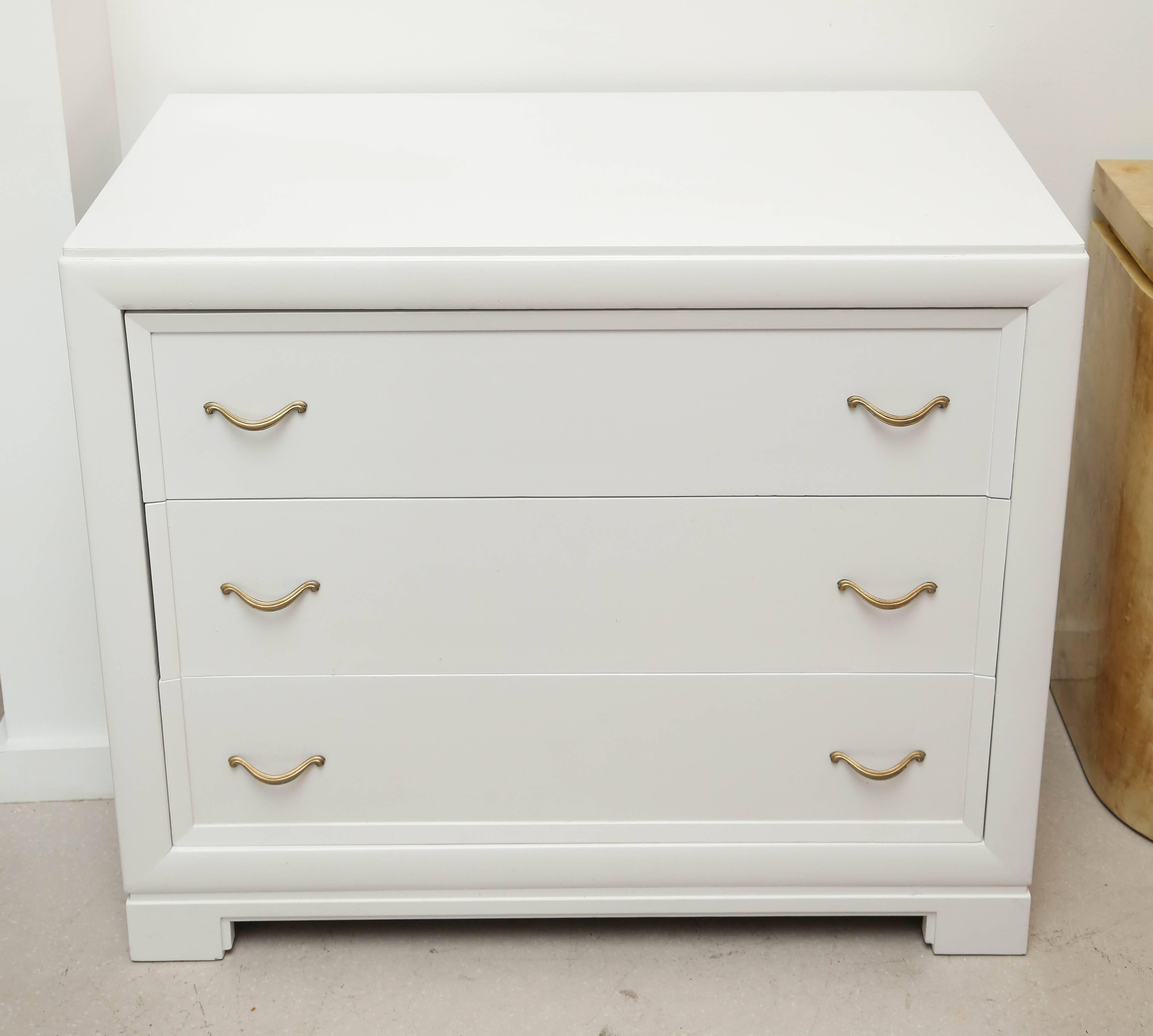 Pair of chests lacquered in white with three deep drawers each.