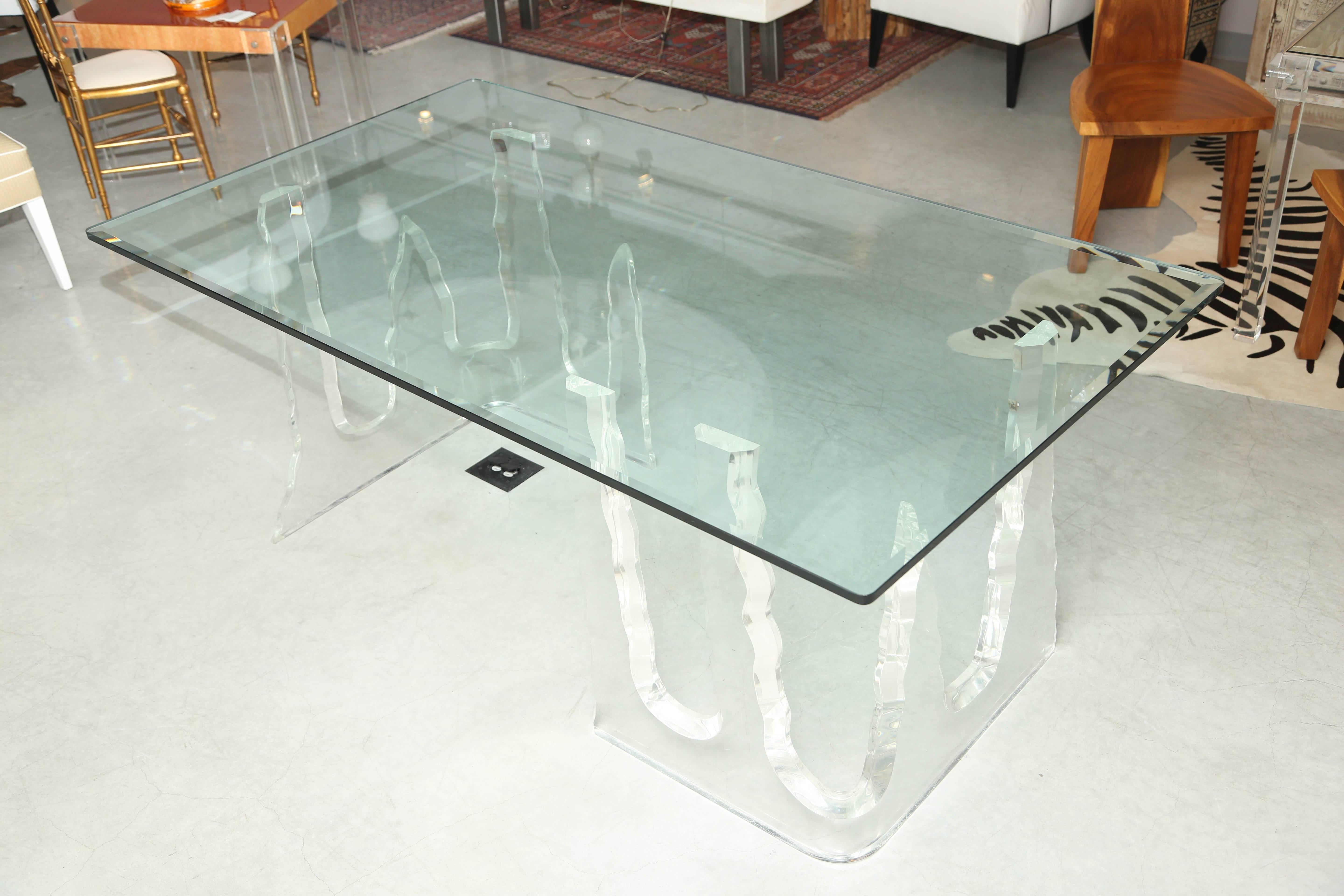 The glass top is optional, the bases can support a larger top, top is for display purposes.
It is on a cement floor, so it is shown with no contrast.
On a dark floor would show the drama of this massive table.
Each pedestal measures 22" x 27