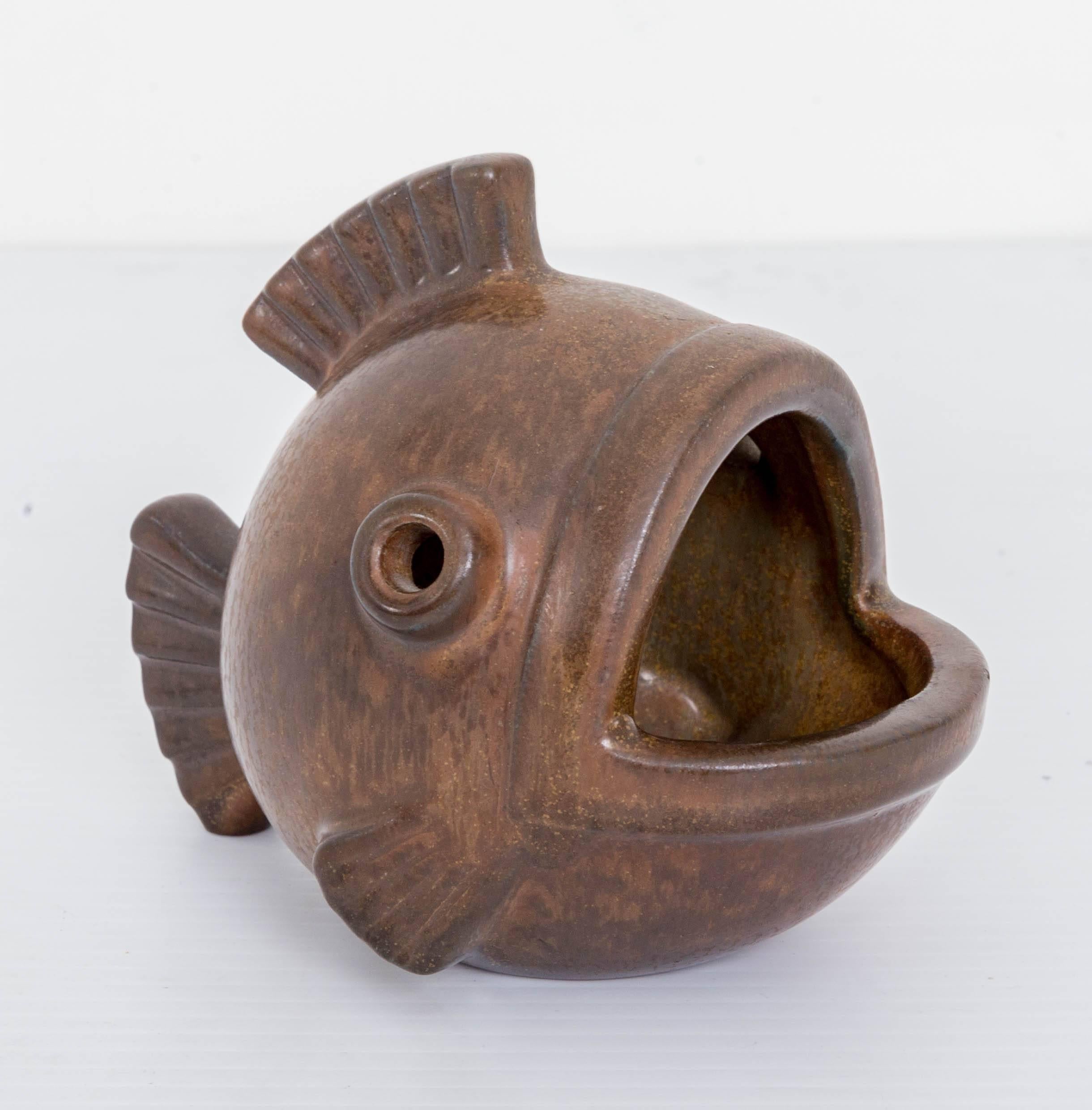 Mid-Century Scandinavian stoneware ceramic fish, with a rich matte feldspar brown glaze, designed by Gunnar Nylund (1904-1997) for Rorstrand Stoneware. Marked on the bottom with 