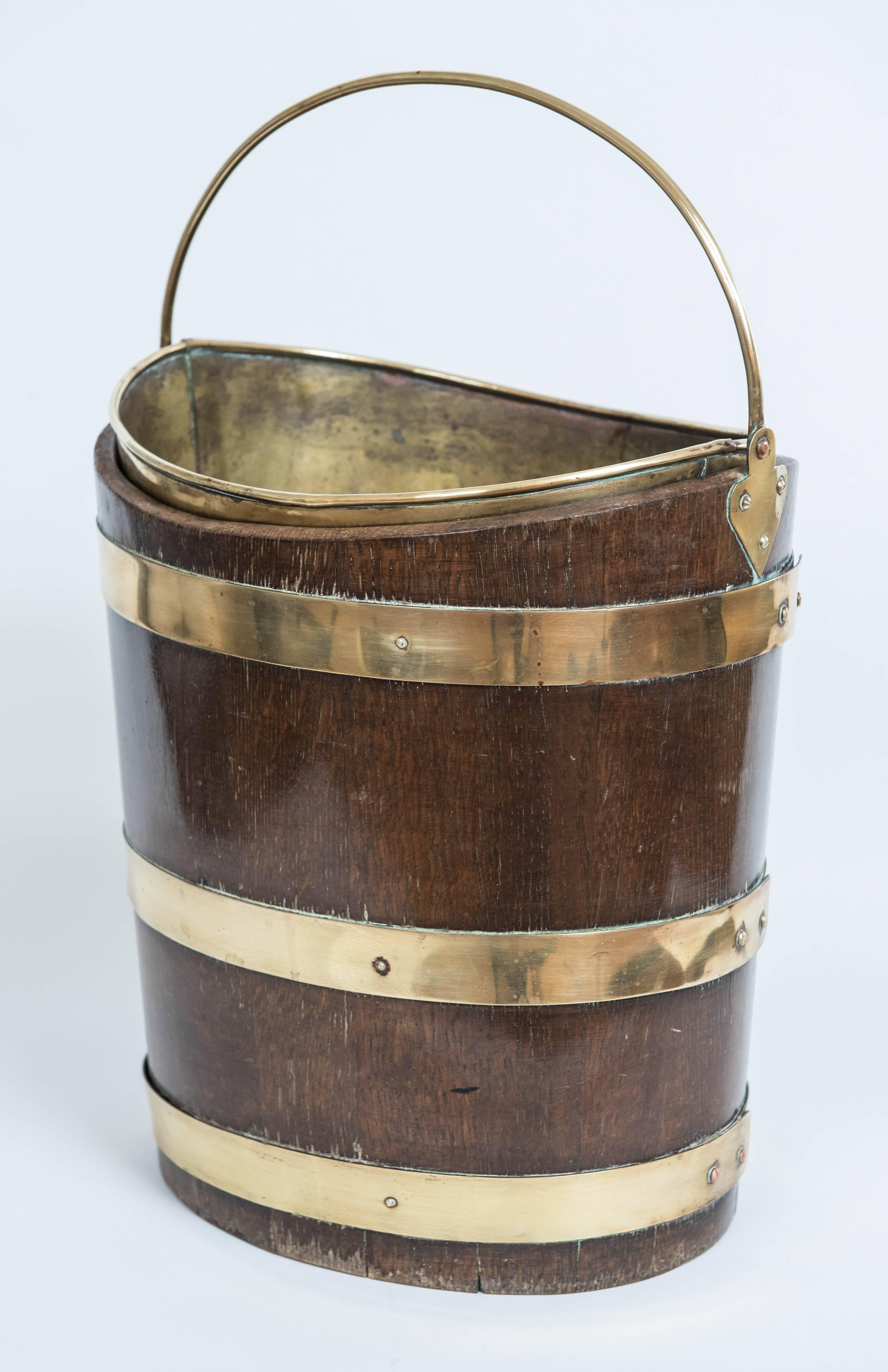 A Classic oval wooden peat bucket in 