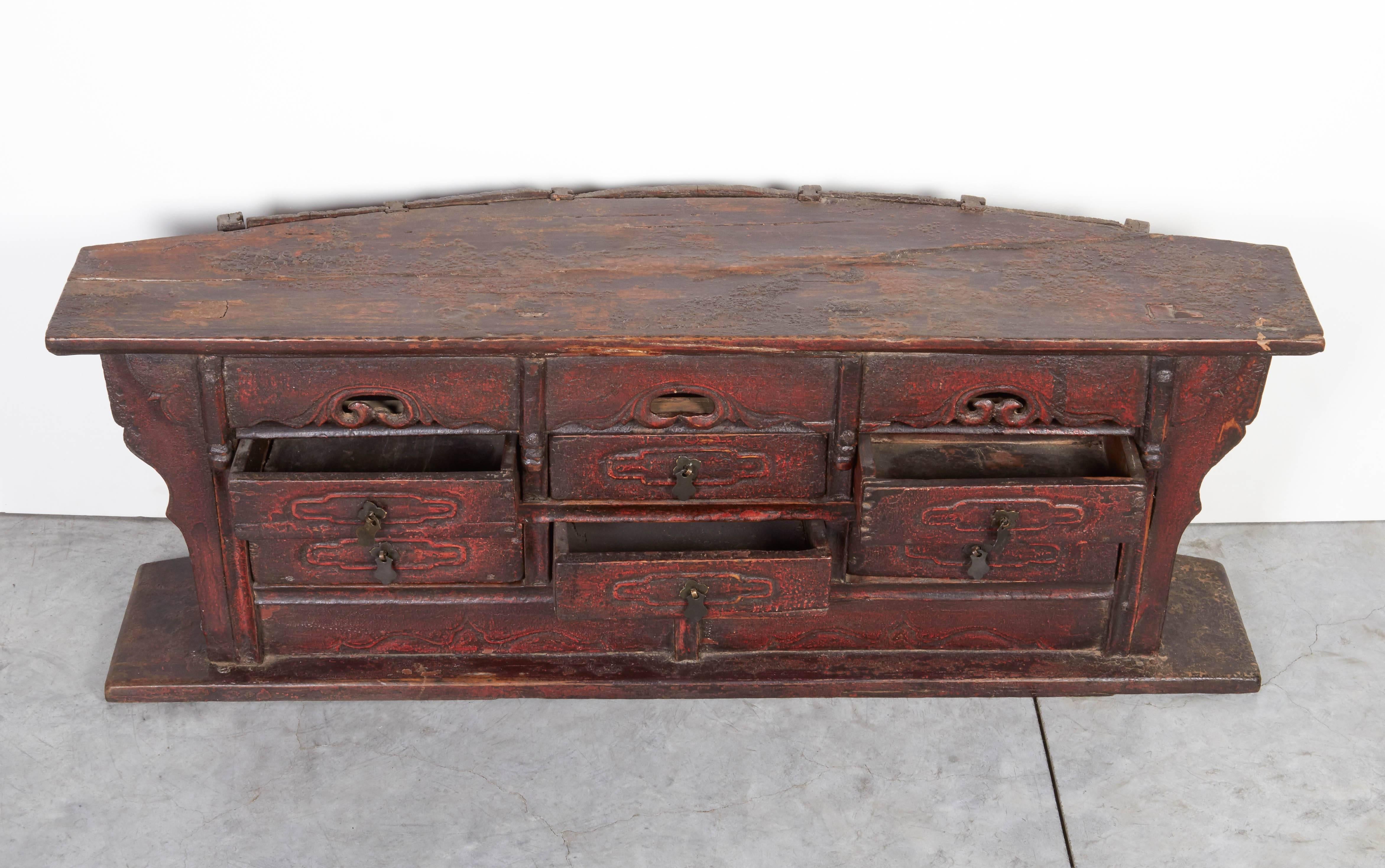 An unusually shaped small antique Chinese apothecary cabinet with original hardware and warm patina. This piece is not only beautiful, but has many practical uses, including as a jewelry box or storage for small collectibles. From Shanxi Province.