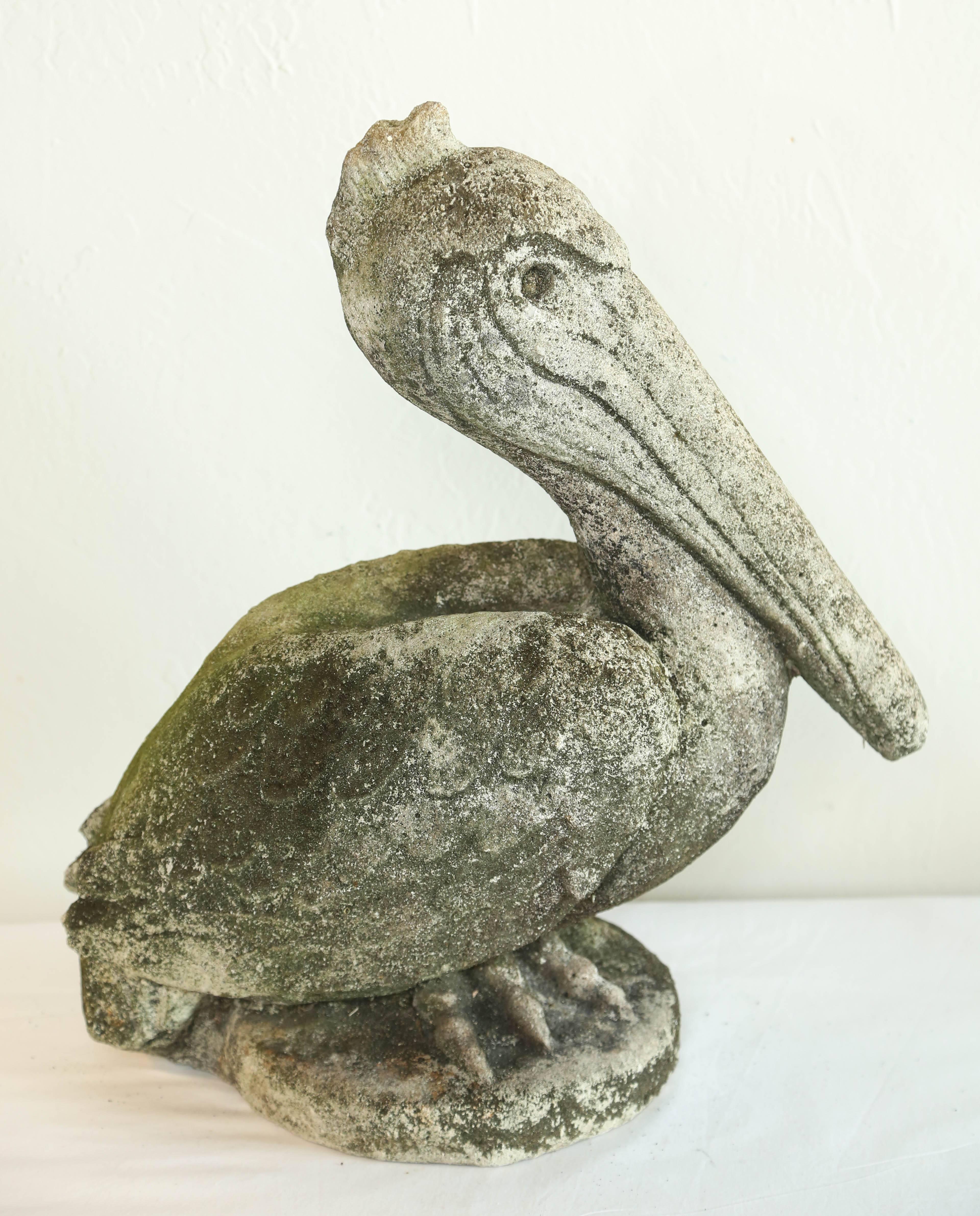 Whimsical stone pelican with lovely patina. Looking for a garden to watch over.