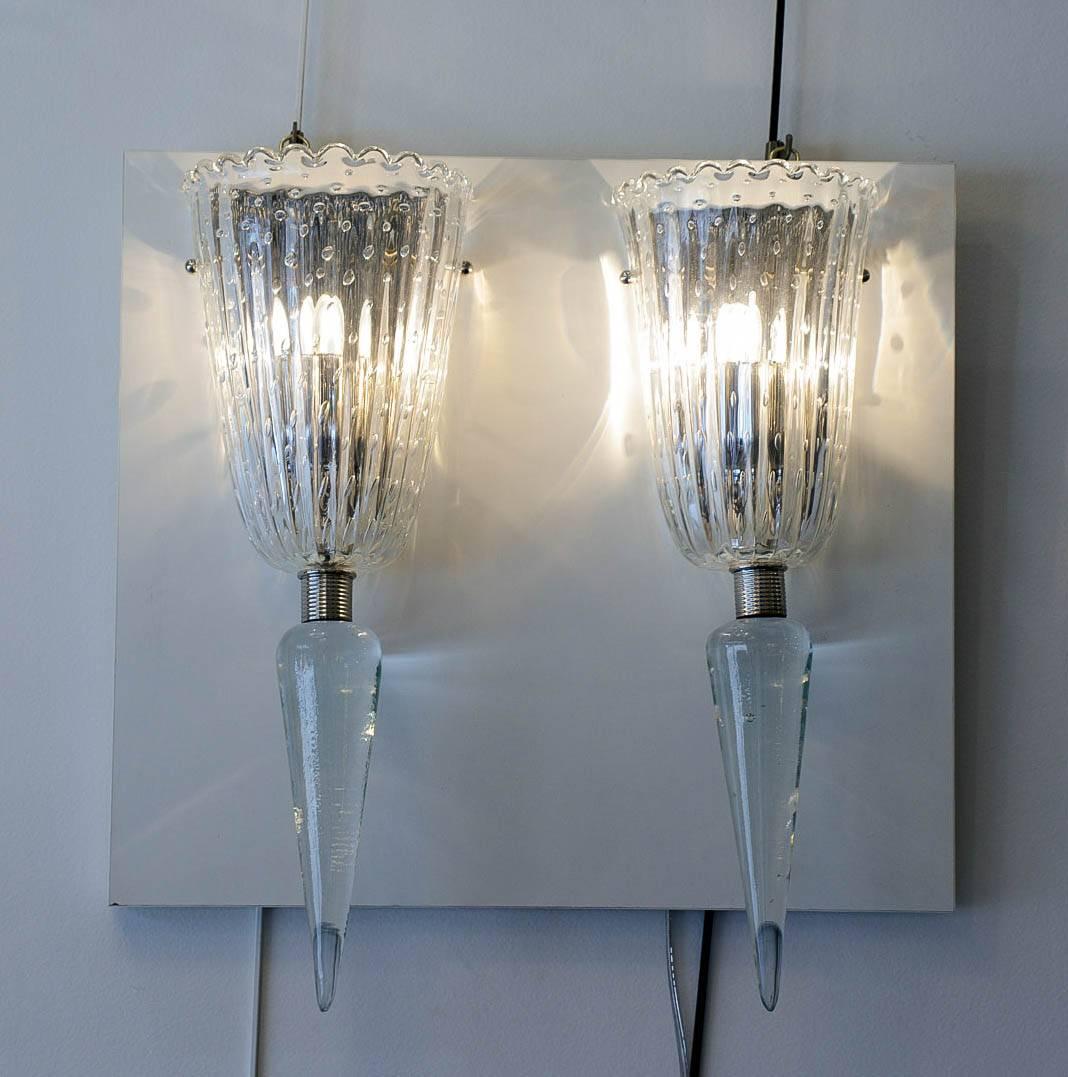 Pair of sconces in Murano translucent glass.
One bulb in each sconce.

Two pairs are available.