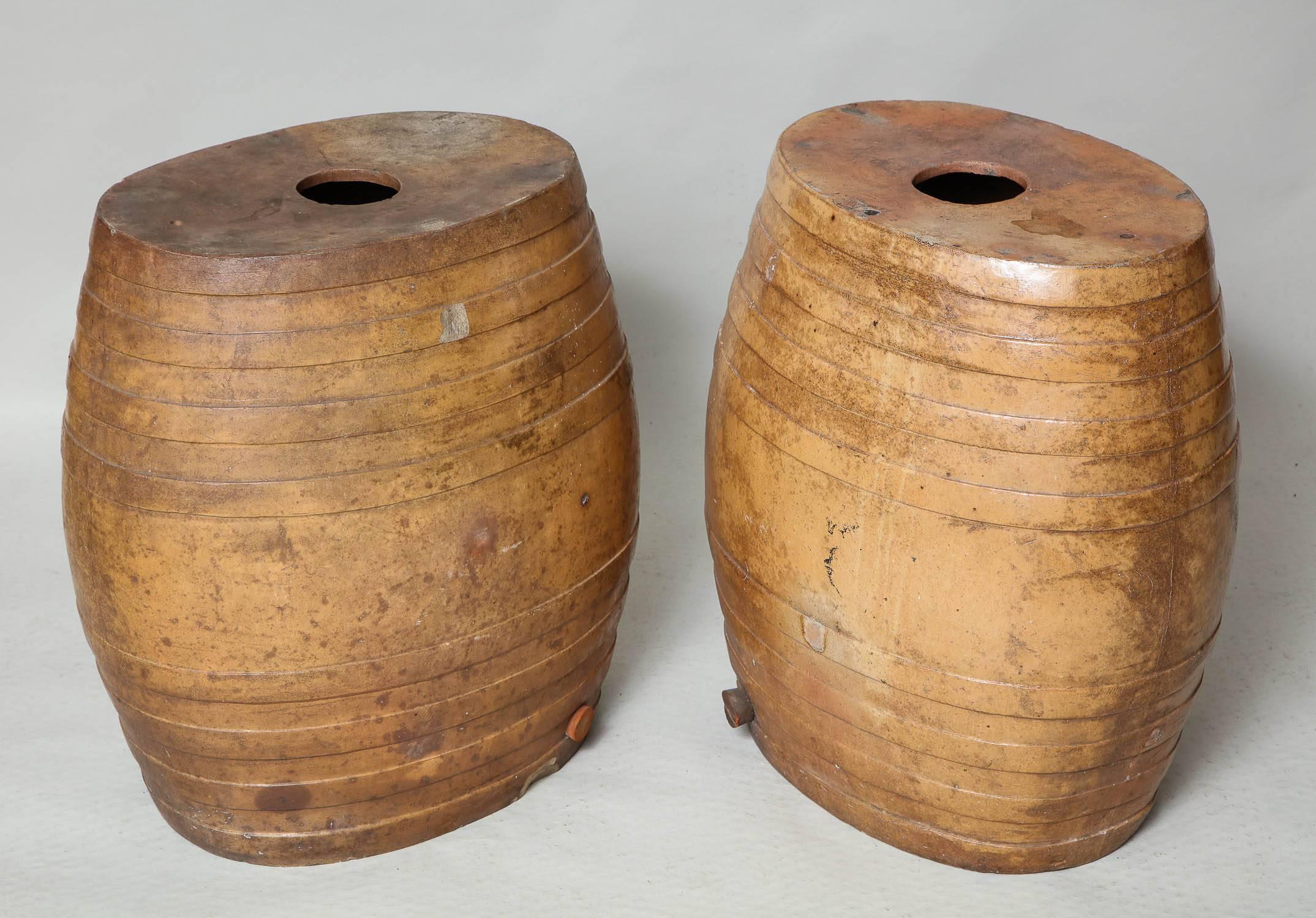 Unusual pair of glazed pottery water barrels by H.B. Williams Ferrys Pottery, Lambeth, London, which work well as side tables or garden stools.